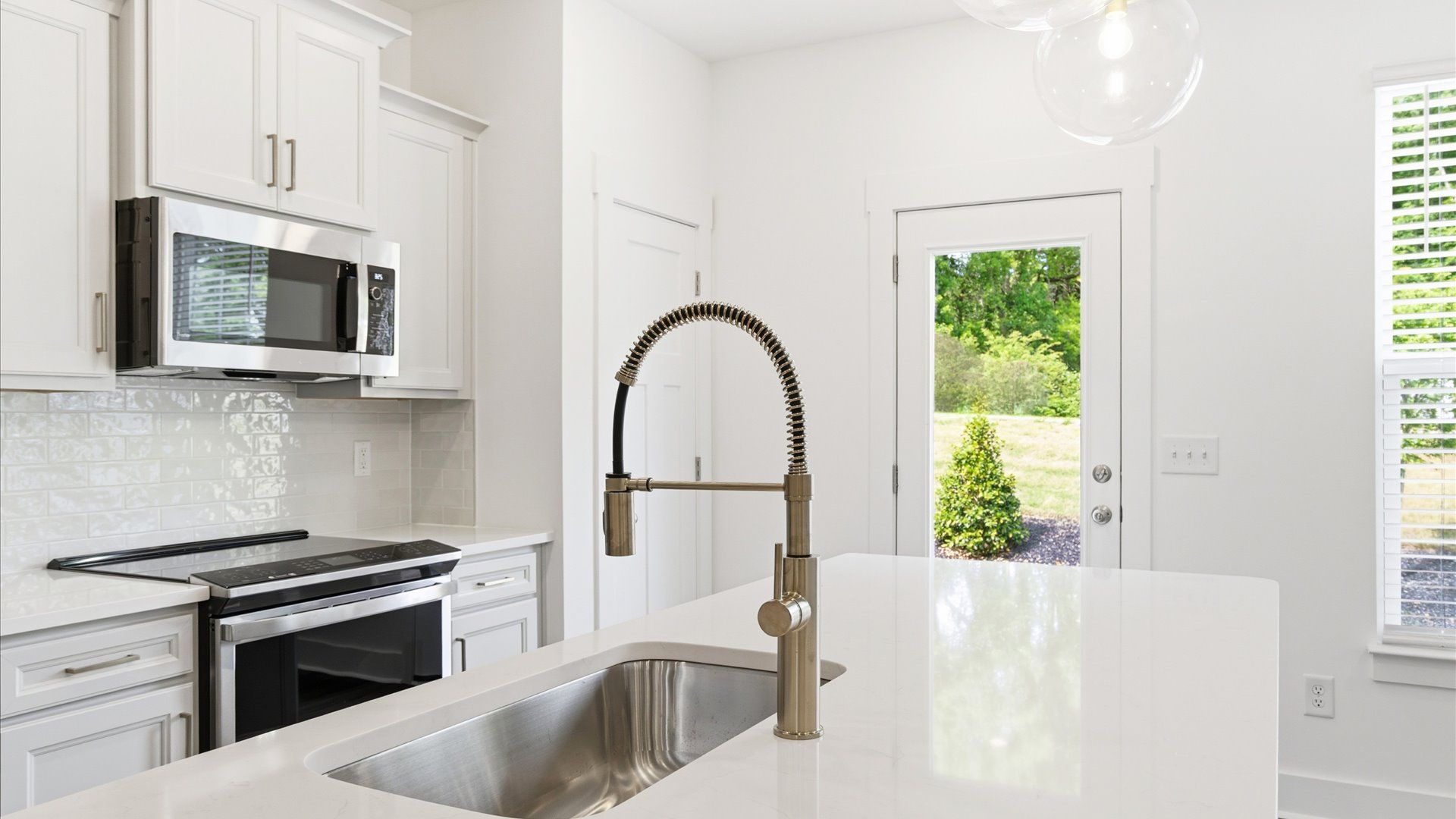 Memorable meals begin in this vibrant kitchen with pendant lighting and a thoughtfully designed island in Simpsonville, SC