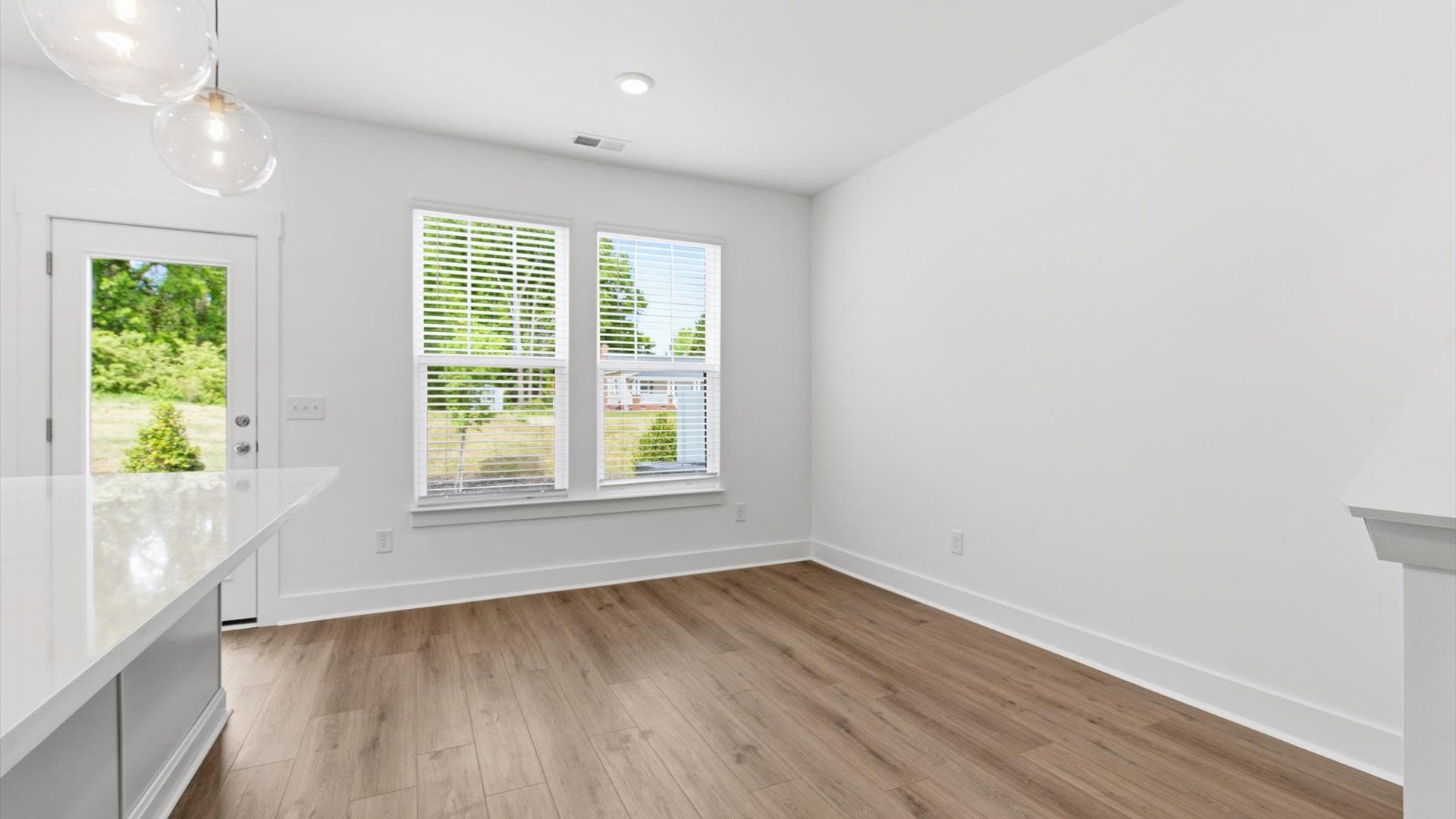 Light-filled breakfast area offering a comfortable space to gather and unwind at the Gresham Station community