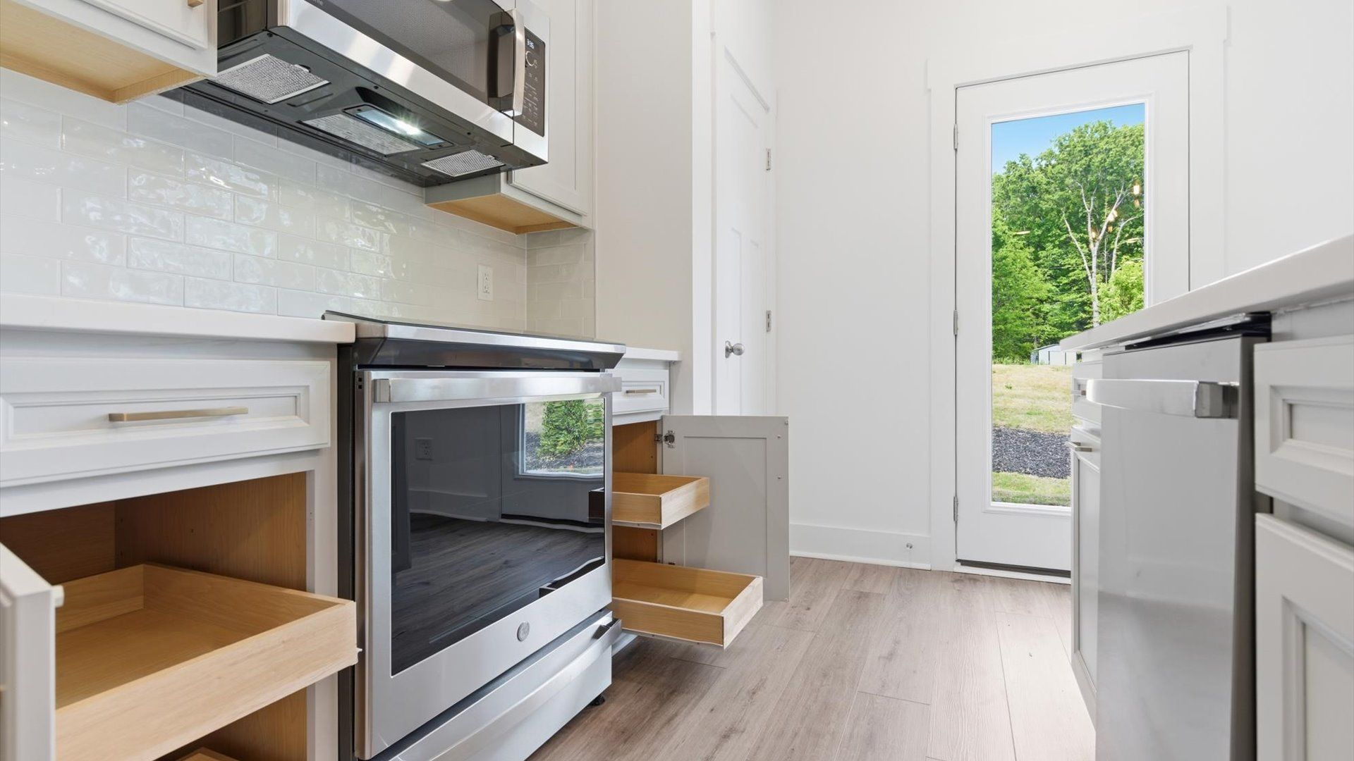 Top-notch kitchen featuring sleek cabinetry, abundant storage, and natural light near Downtown Simpsonville