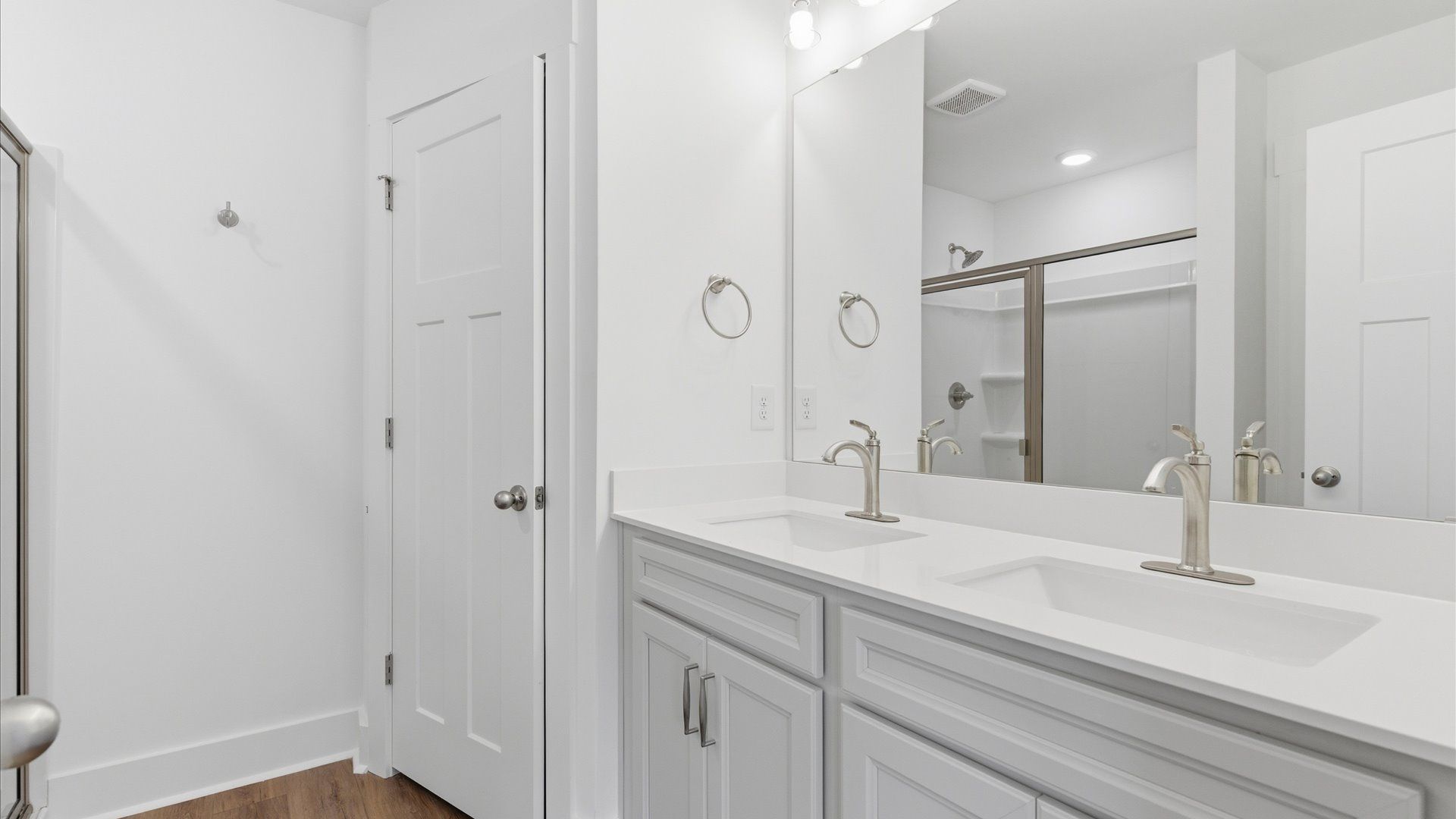 Memorable mornings begin in this elegant primary bathroom with walk-in shower and double vanity at Gresham Station