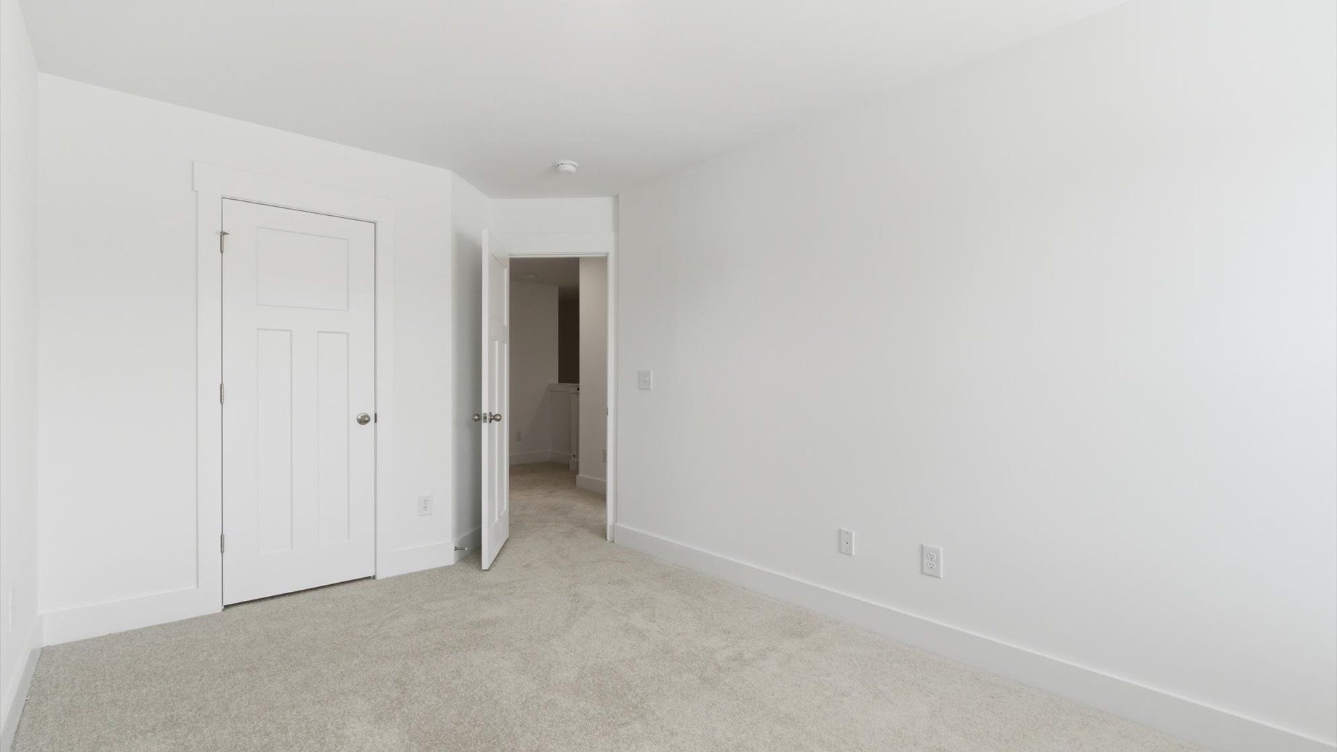 Superior comfort in a secondary bedroom with plush carpet and an oversized walk-in closet in Simpsonville, SC