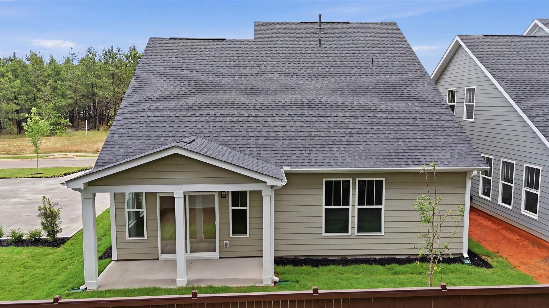 Exceptional outdoor living begins with a covered back porch in this thoughtfully designed home in Fountain Inn, SC