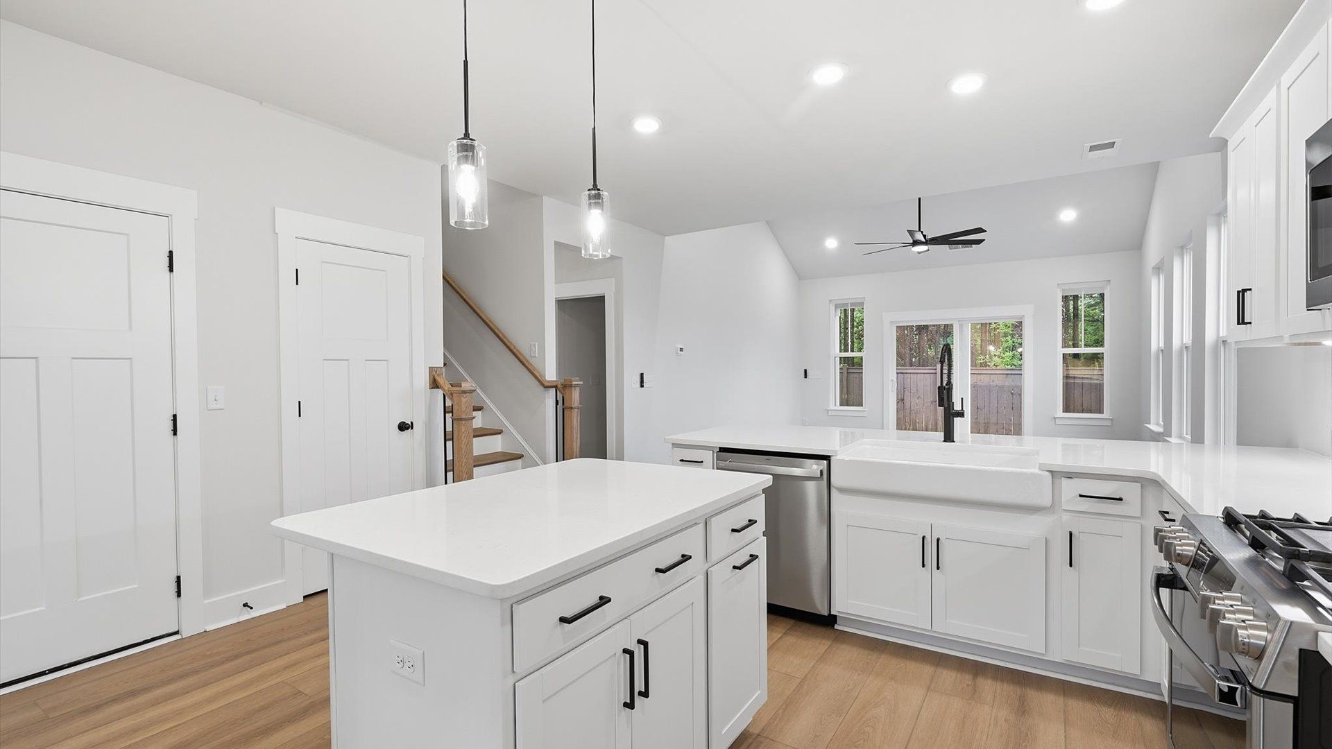 Exceptional kitchen featuring a center island, eye-catching pendant lights, and modern finishes