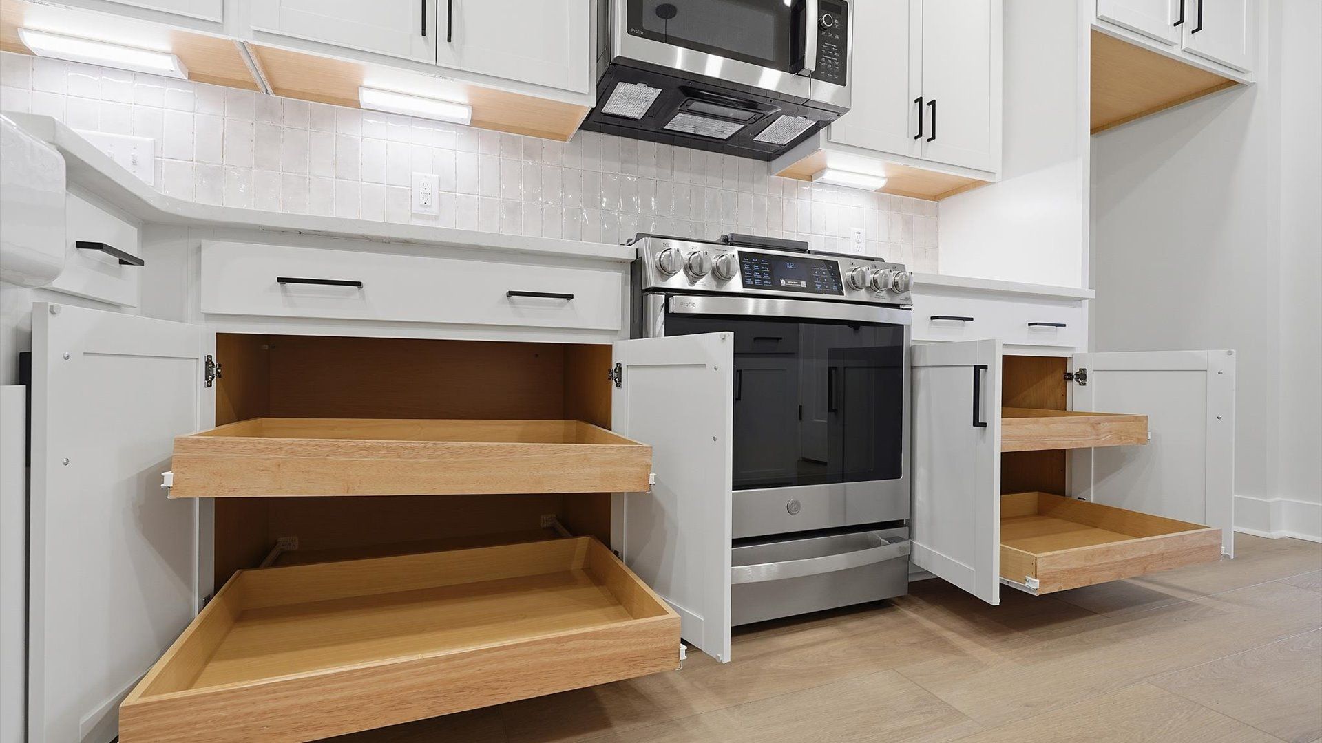 Superior kitchen with quartz countertops, sleek cabinetry, and hardwood floors located at Barton Hollow