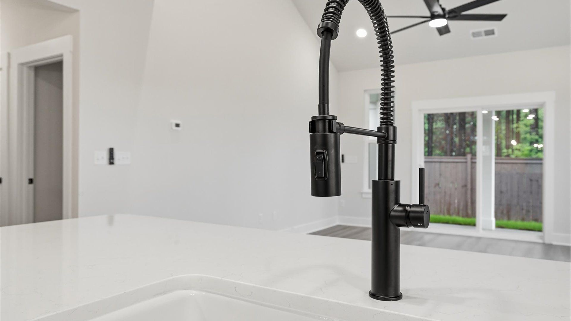 Exclusive DRB Homes kitchen with elevated finishes, quartz countertops and open sightlines in a prime location