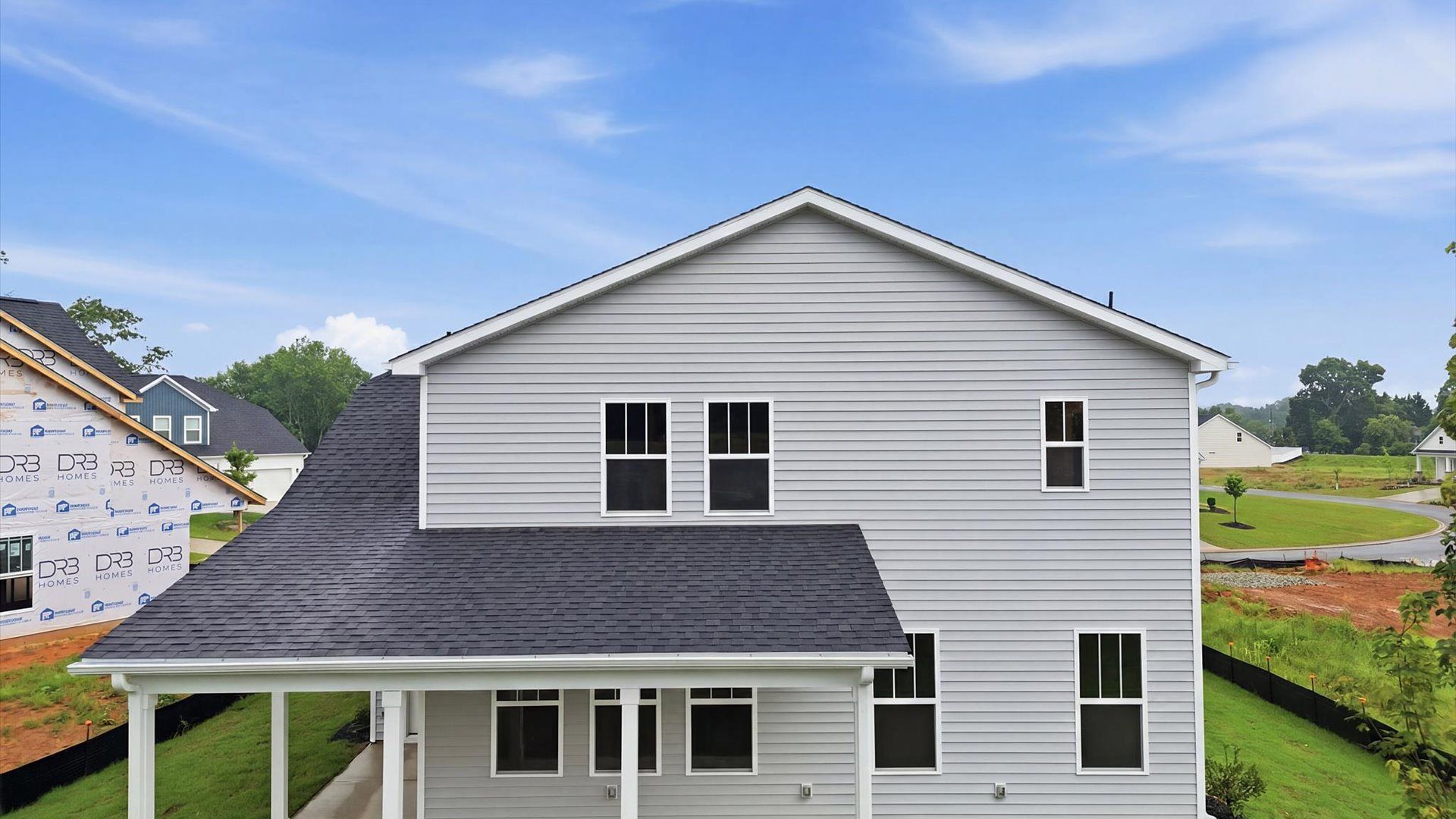 Refined rear exterior with a stylish covered porch for dining, relaxing, or entertaining in Piedmont, SC