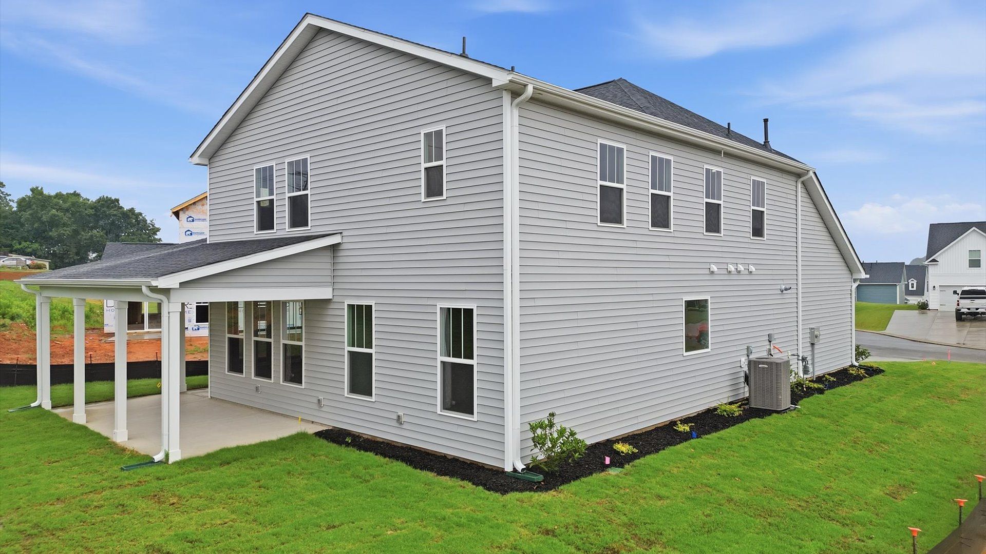 Highly functional rear covered porch adds memorable living space to this elegant home in Piedmont, SC