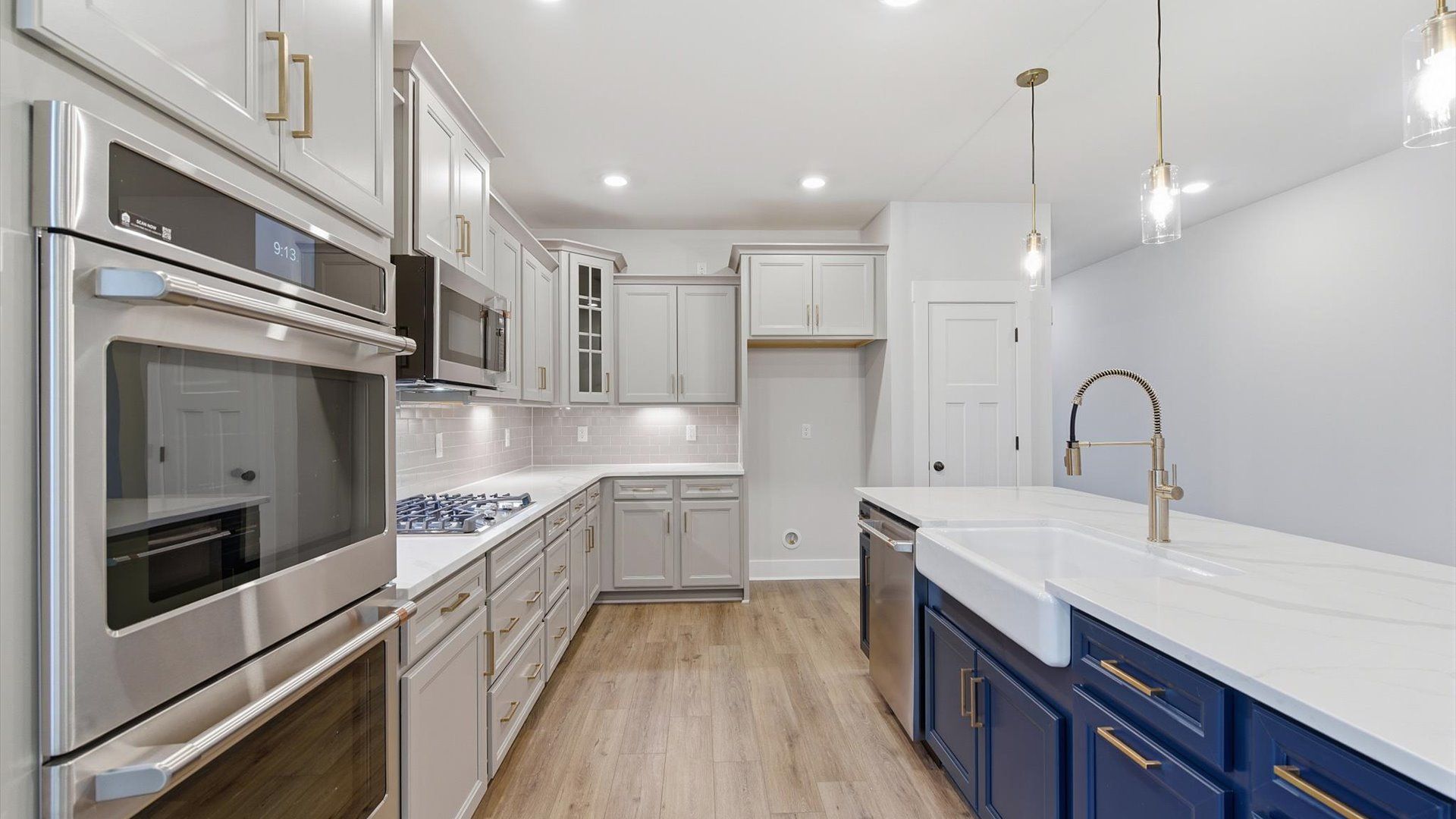 First-rate kitchen with functional layout, designer pendant lighting, and a large center island in Piedmont, SC