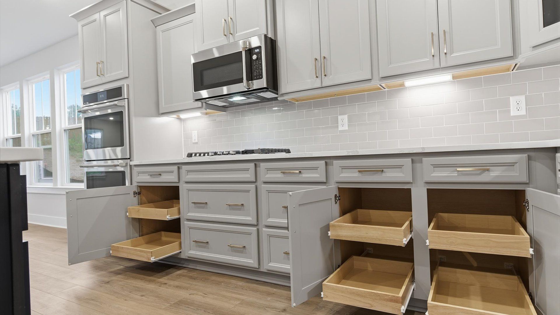 Tasteful kitchen with sleek cabinetry—crafted to high standards at the Woodglen community