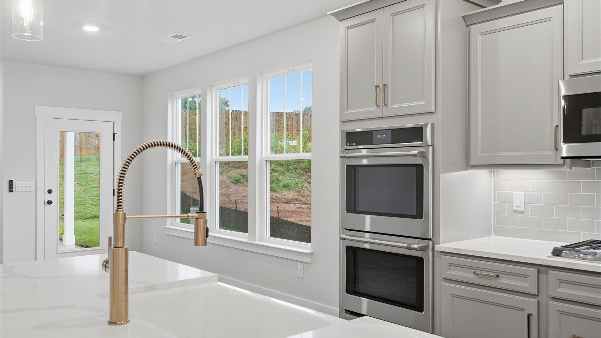 Well-designed kitchen with a center island and tasteful finishes that elevate everyday living