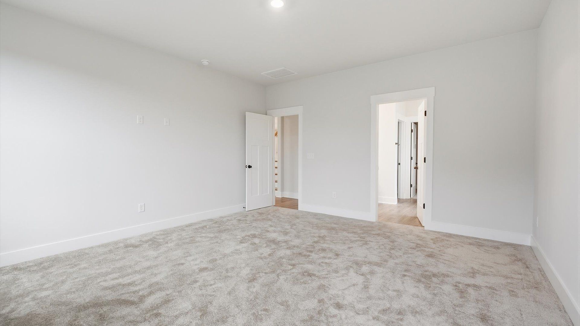Spacious and serene primary suite with thoughtful design in a desirable DRB Homes community
