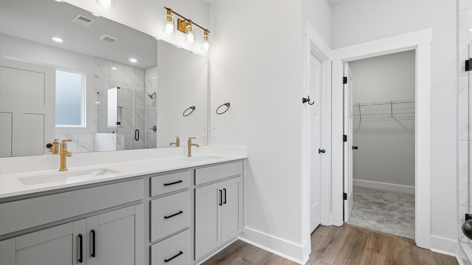 Tasteful primary bath with modern finishes, a walk-in shower, and thoughtful double vanity layout in Piedmont, SC