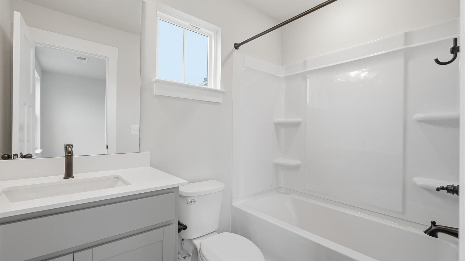 First-class guest bath featuring stylish fixtures and modern design elements located in Piedmont, SC