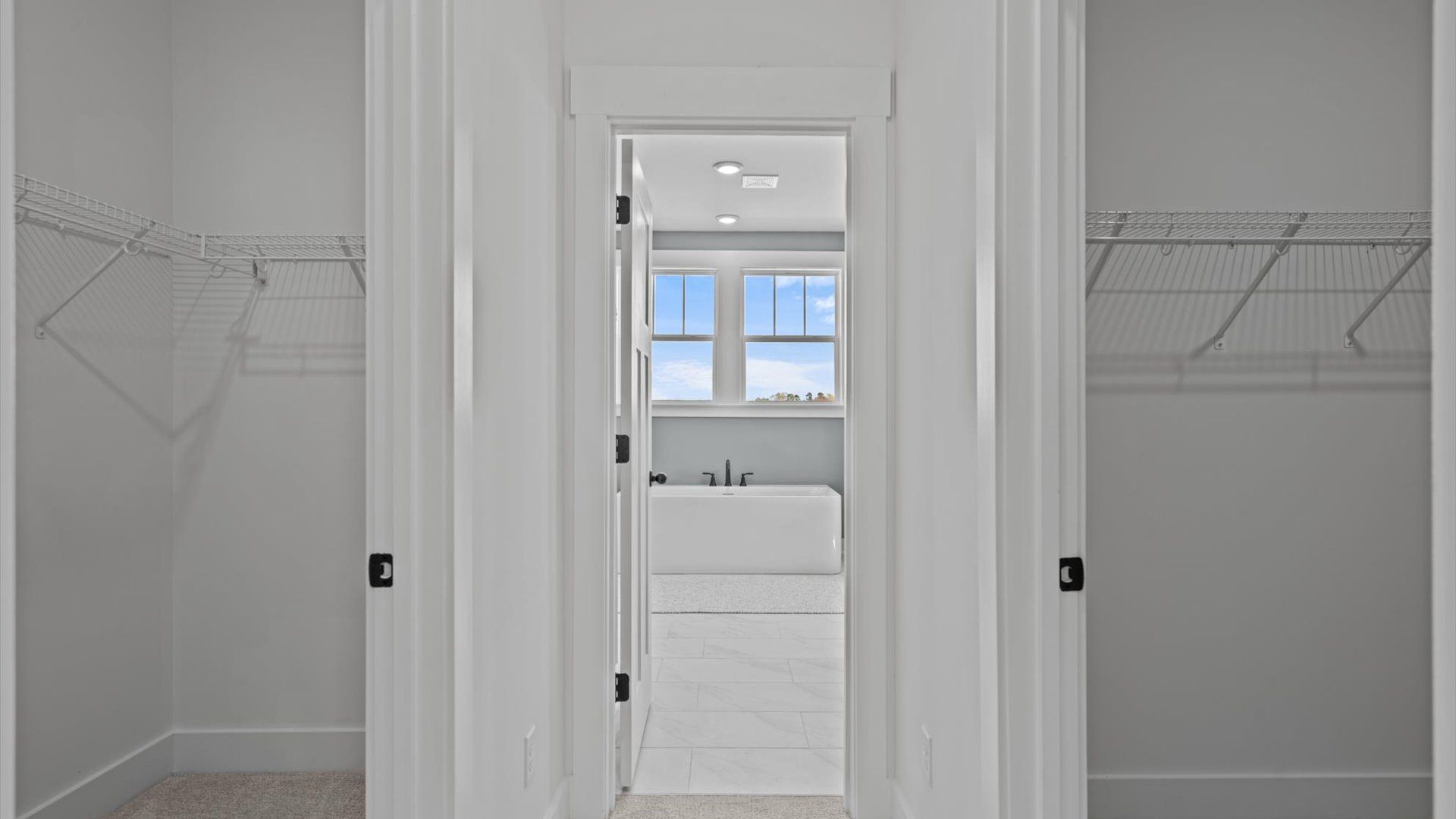 Large primary walk-in closet with lots of storage space located at Pinebrook in Woodruff, SC