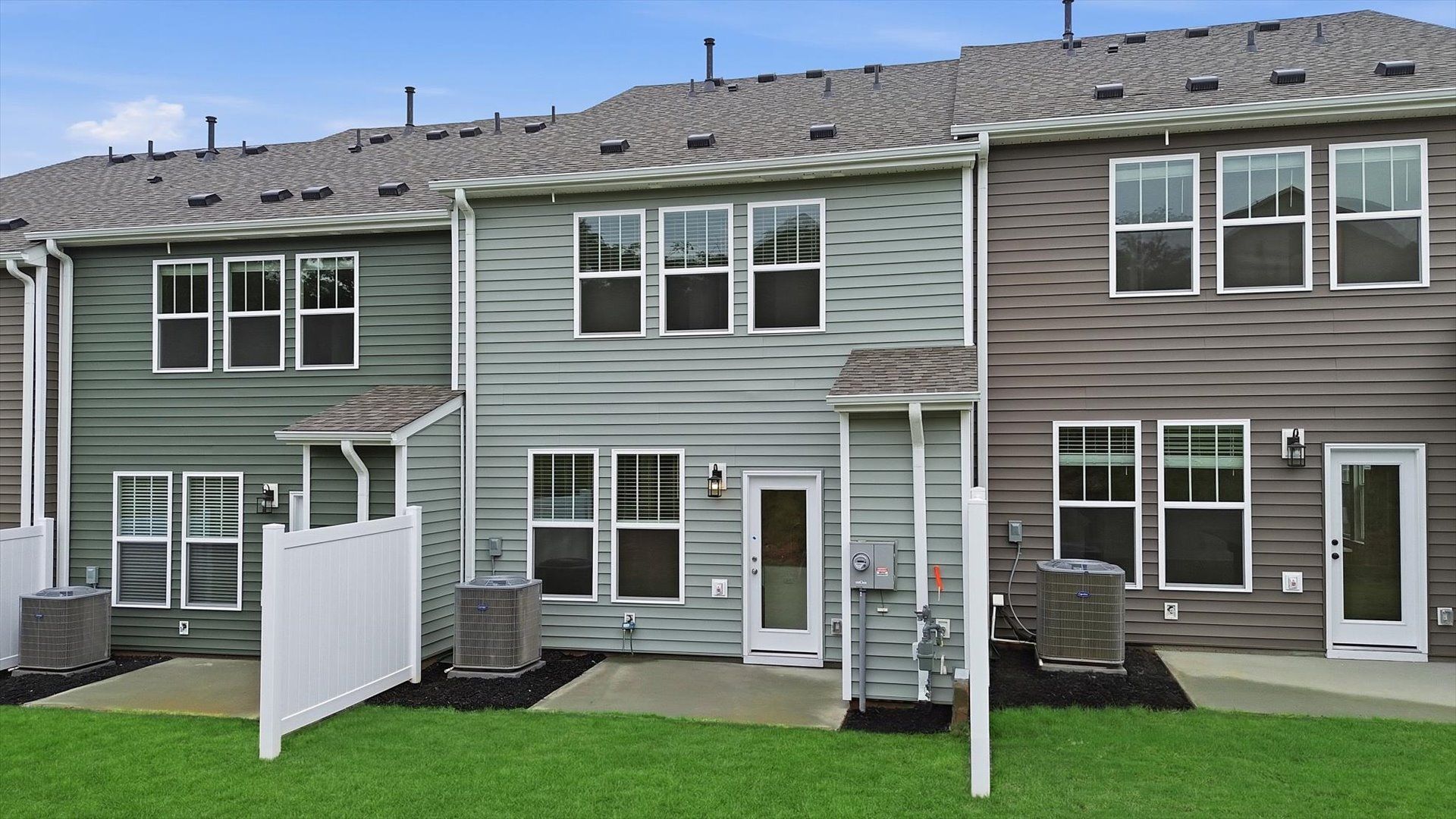Warm and inviting outdoor living space with a spacious patio and tasteful finishes by DRB Homes