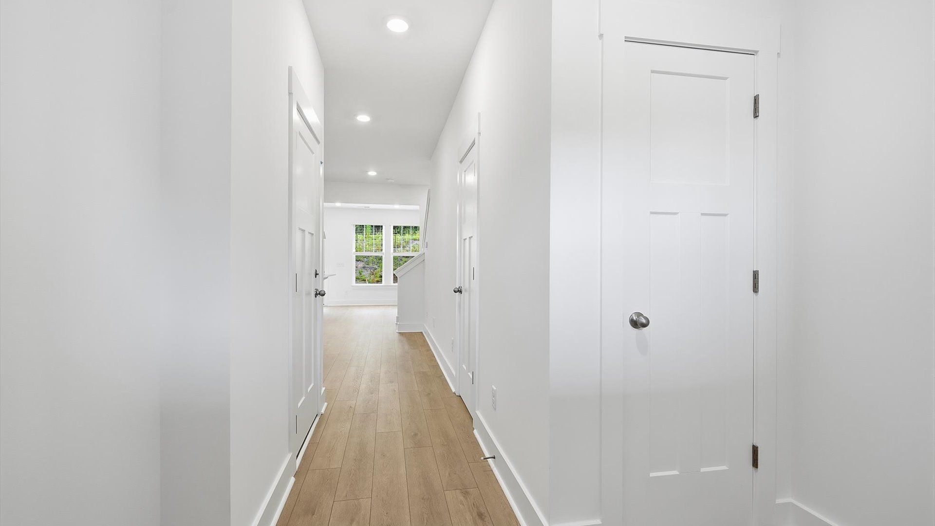 Refined foyer with hardwood floors and thoughtful design for a first-rate welcome