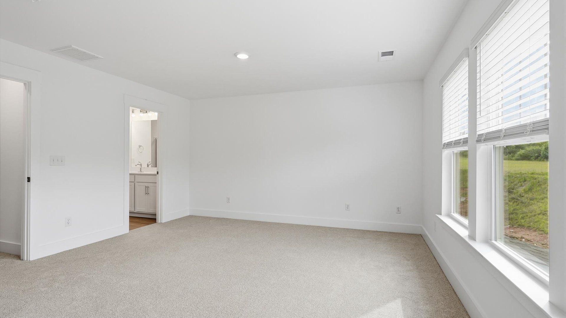 Spacious and serene primary suite with thoughtful design in a desirable DRB Homes community