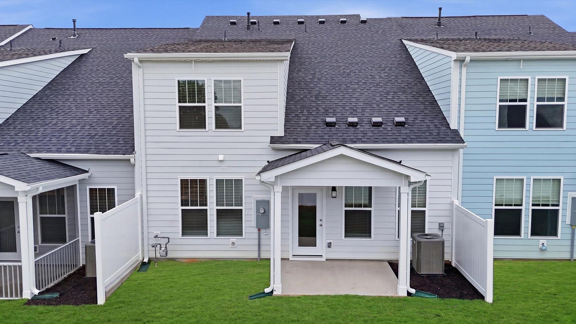 Refined rear exterior with a stylish covered porch for dining, relaxing, or entertaining by DRB Homes
