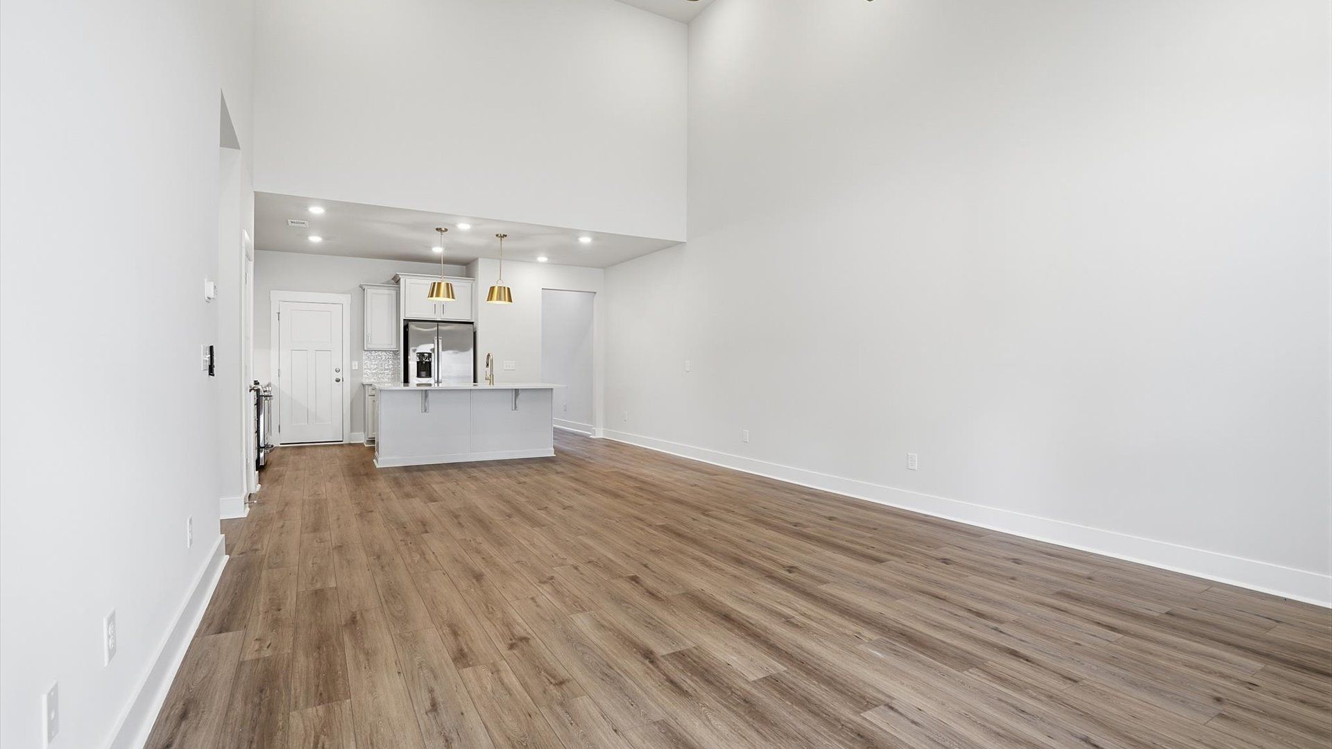 Notable two-story family room offering a grand yet inviting space for memorable everyday living near Lake Hartwell