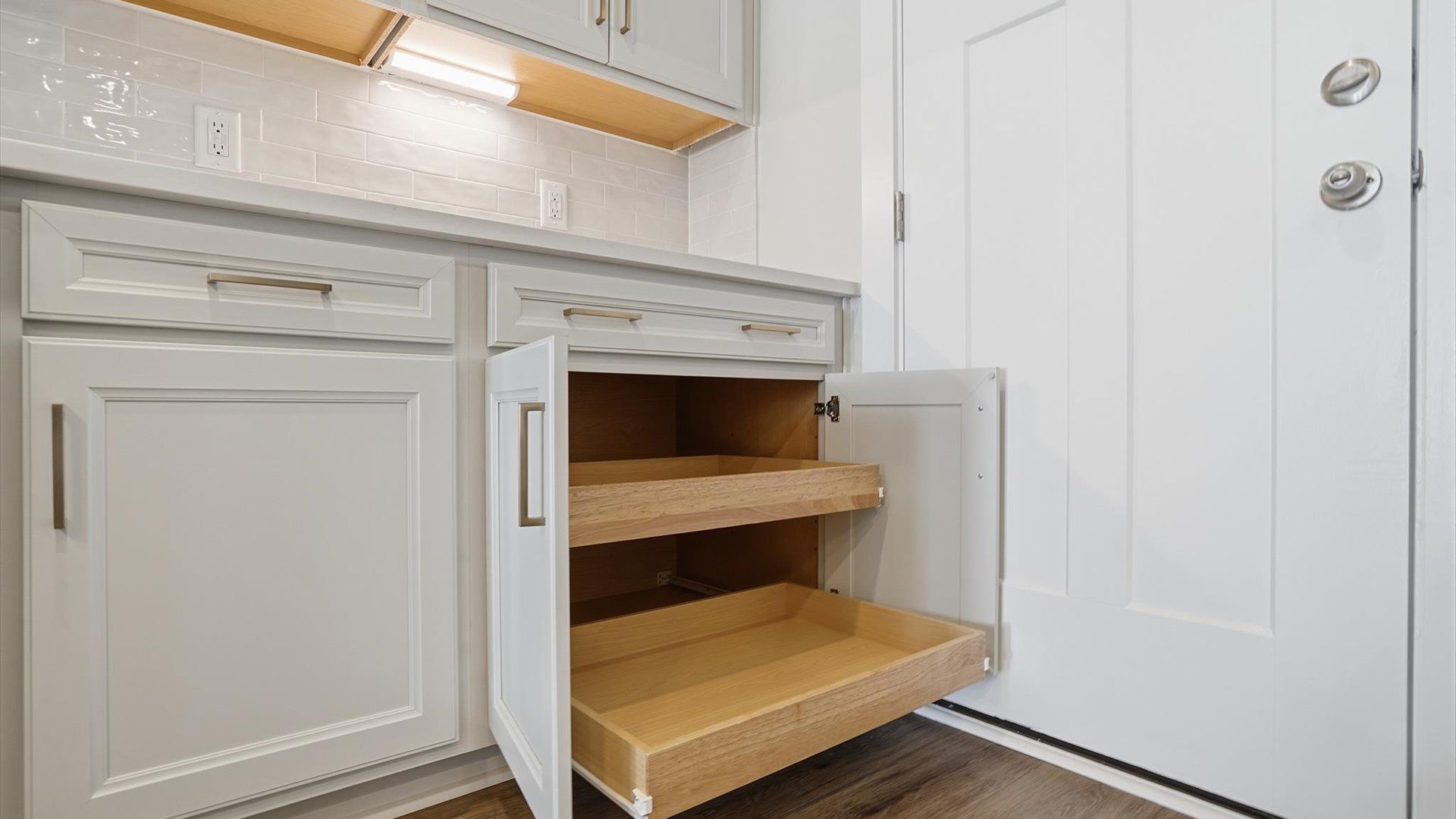Expansive kitchen offering exceptional storage and sleek cabinetry located at Village at Midway