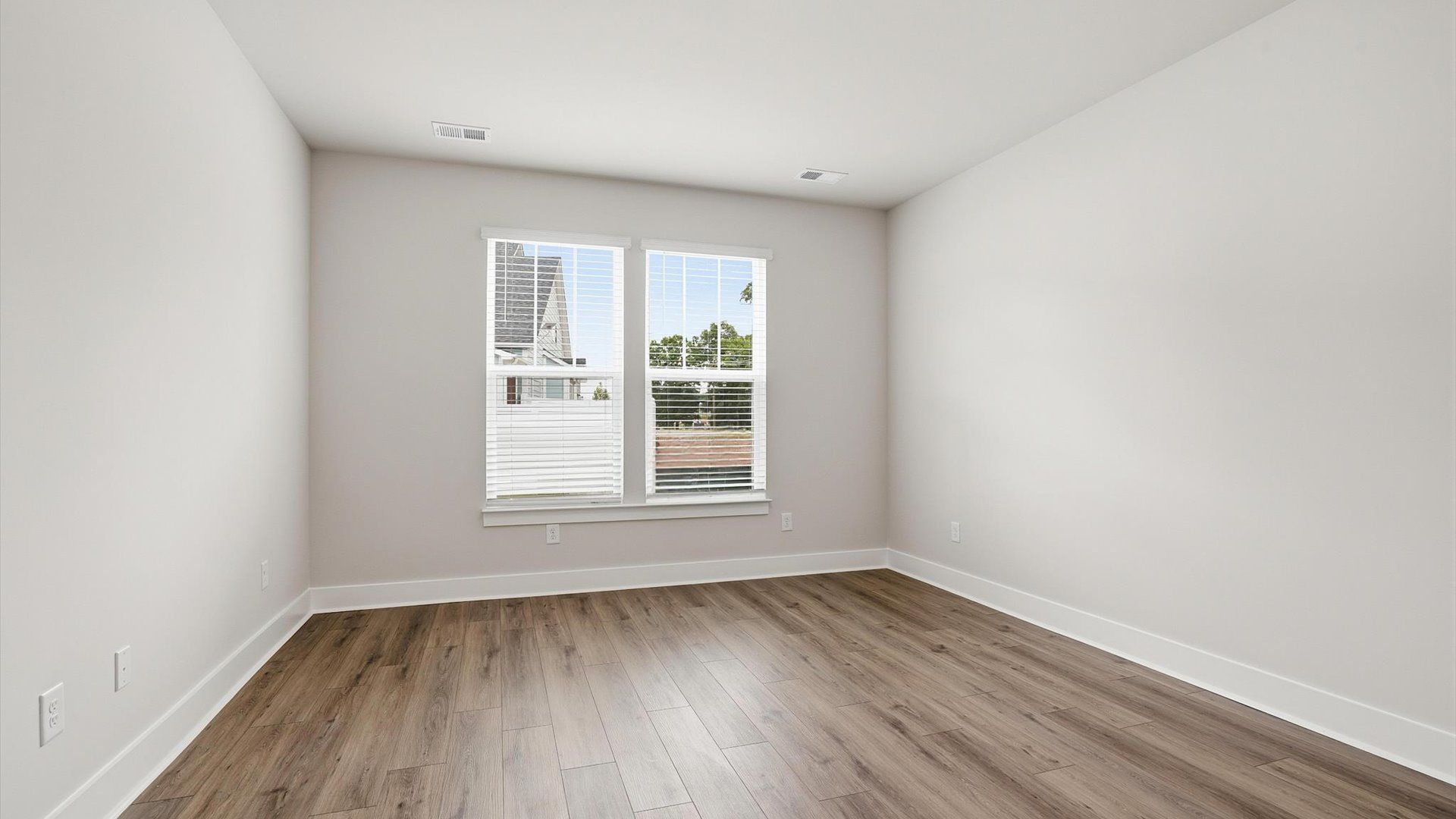 Primary suite that offers first-rate relaxation with established style and elevated finishes by DRB Homes