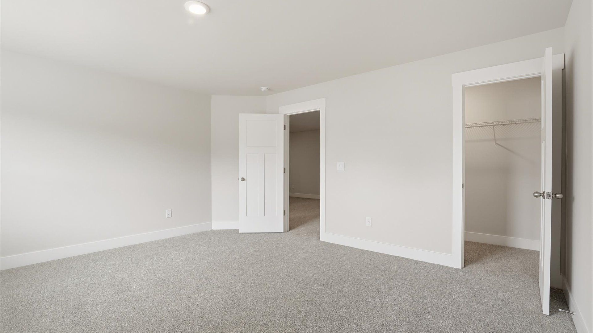 Highly functional bedroom with walk-in closet and tasteful carpet for a restful retreat located in Anderson, SC