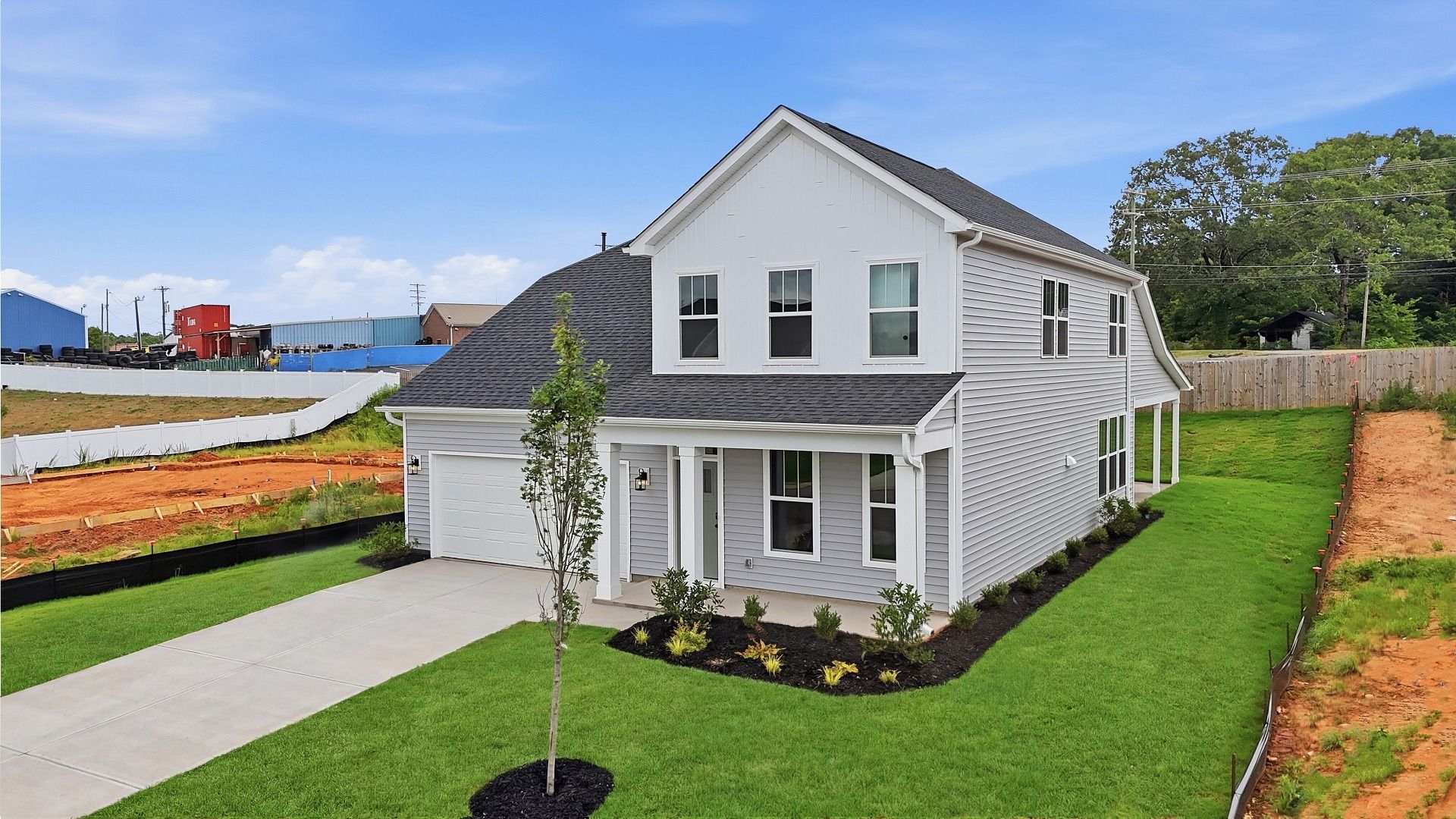 Exclusive DRB Homes exterior with balanced proportions and vibrant curb appeal at the Woodglen community