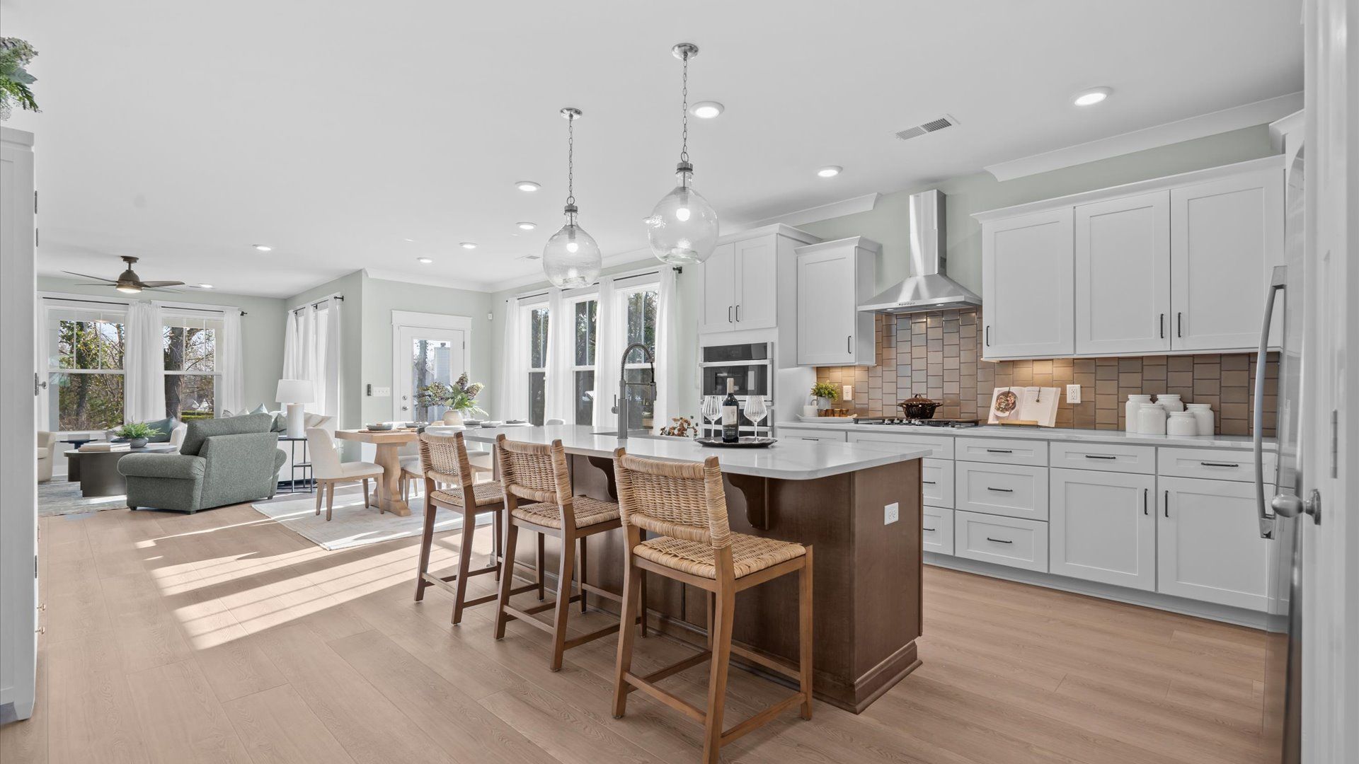 Tasteful kitchen with a streamlined island and modern finishes in a first-class DRB Homes design at the Hinson Farm community
