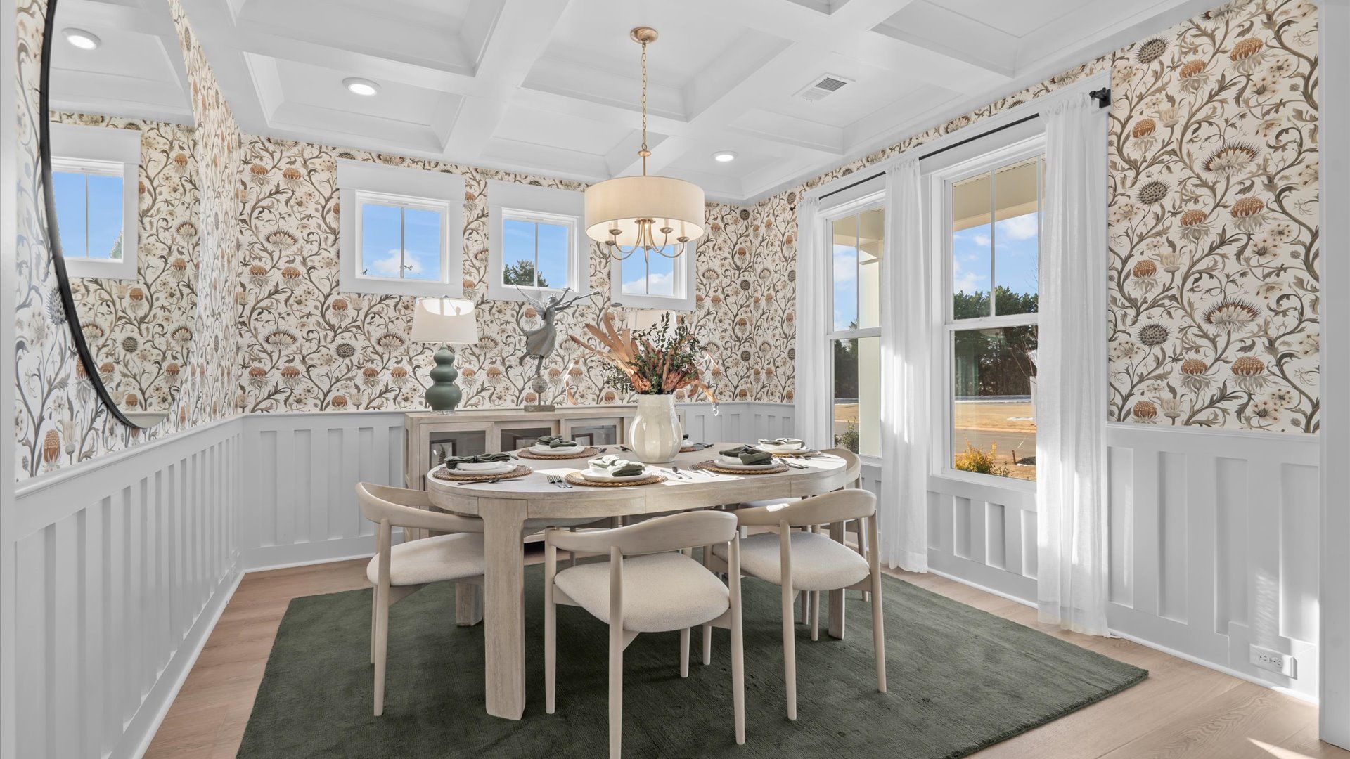 Desirable dining room with coffered ceiling and modern elegance in an established community called Hinson Farm