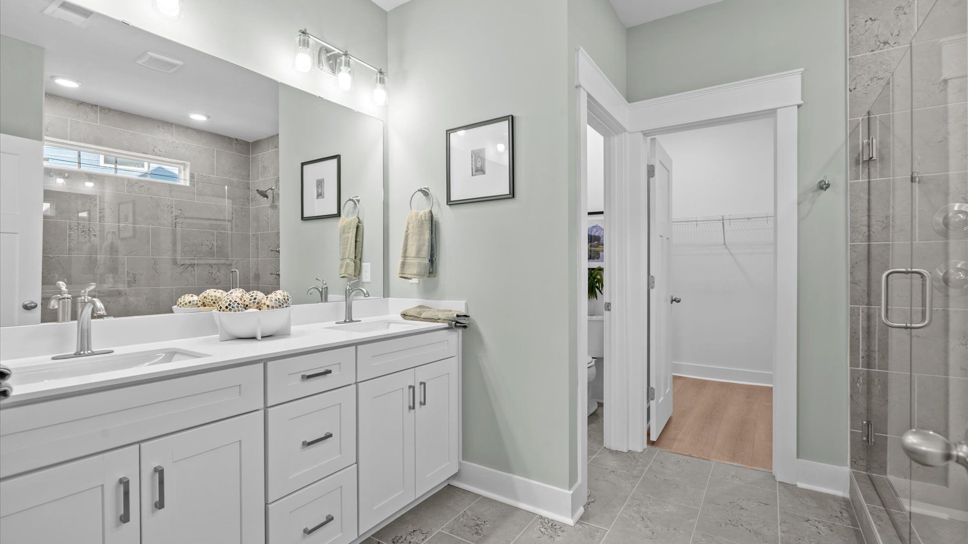 Primary bathroom designed for everyday comfort with elegant finishes throughout at Hinson Farm