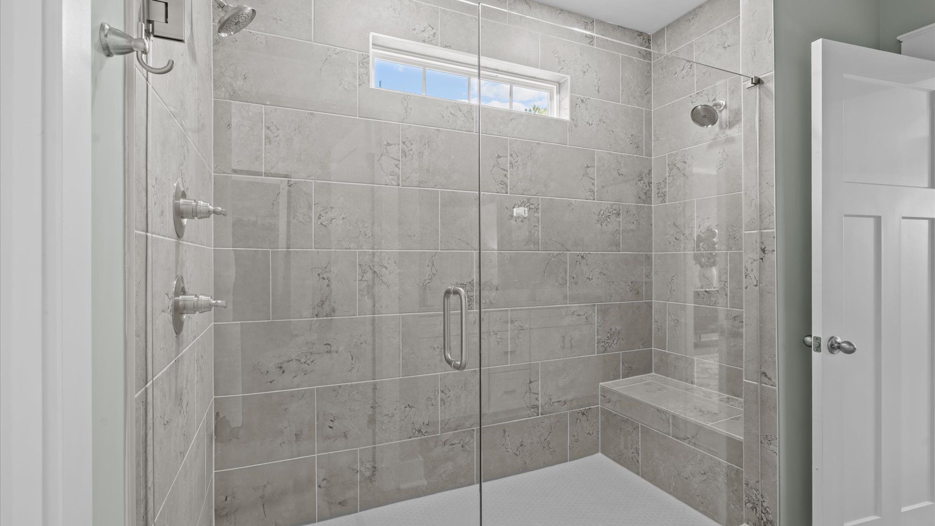 Superior en-suite primary bathroom with a stylish walk-in shower—crafted with high standards in mind in Fountain Inn, SC