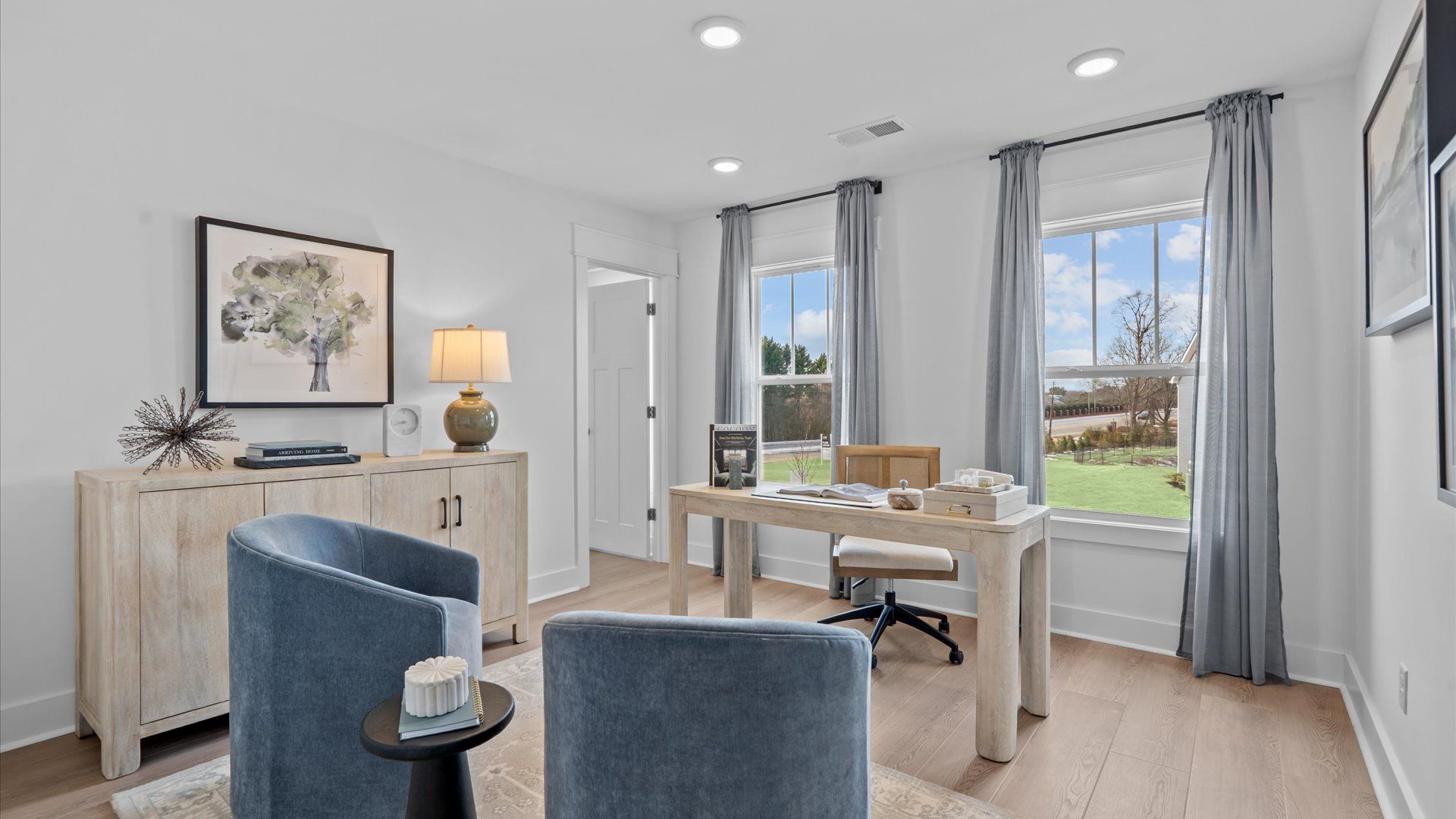 Memorable workspace with hardwood floors, modern finishes, and exceptional light and flow located at Hinson Farm