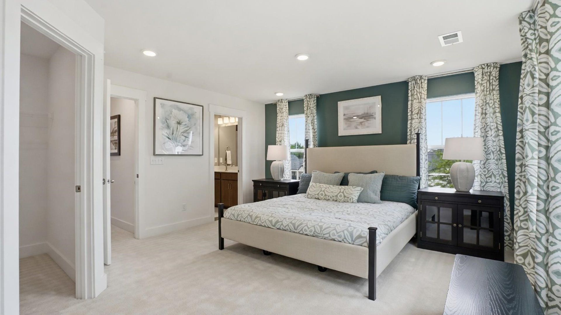 Serene and stylish primary bedroom featuring carpeted flooring and a thoughtful, modern layout at Hinson Farm