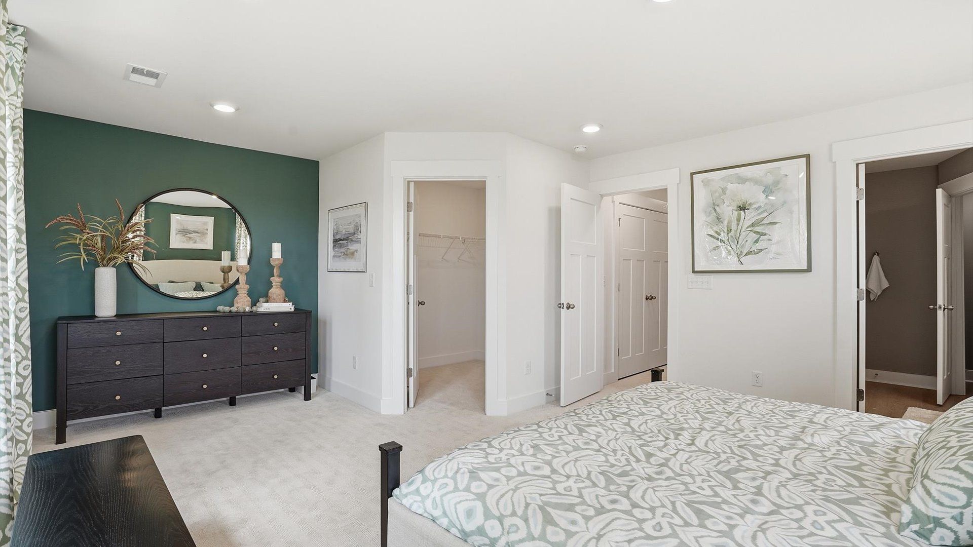 Eye-catching details and elegant finishes in the vibrant primary suite of this select home by DRB Homes