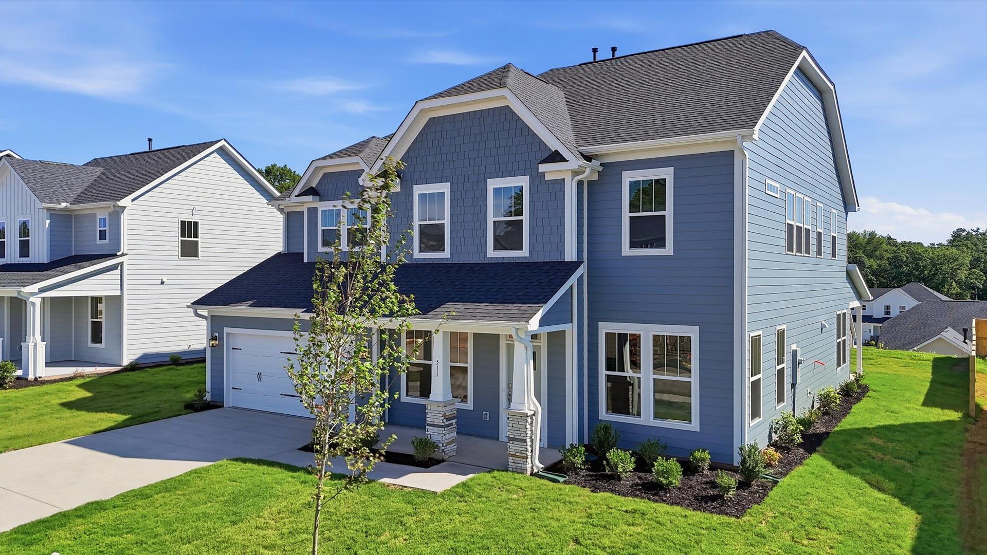 Exceptional home with tasteful exterior finishes and a thoughtfully designed façade at Kayfield at Midway
