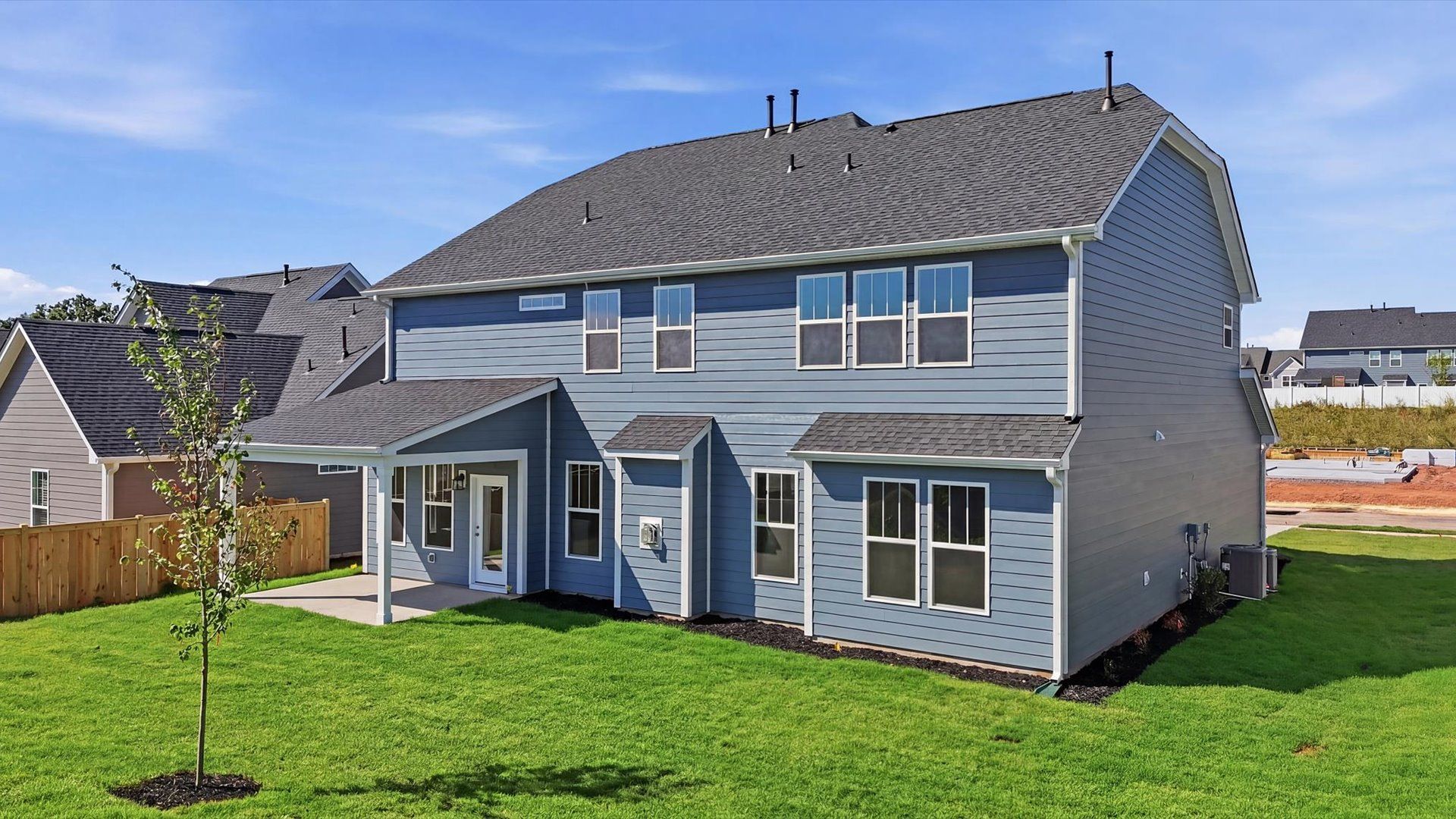 Vibrant rear outdoor space featuring a covered porch and exceptional craftsmanship in Anderson, SC