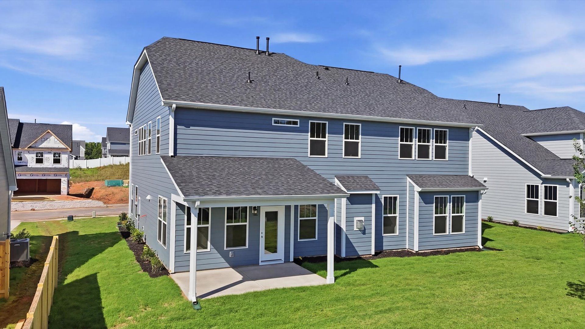 Accomplished exterior with a spacious rear porch that blends comfort and style by DRB Homes
