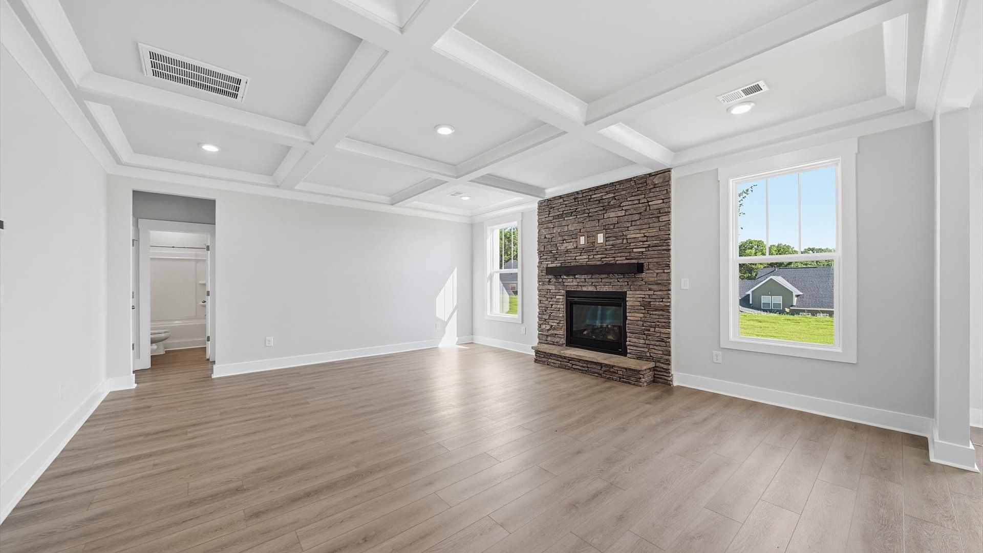 Exceptional family room featuring tasteful finishes and vibrant natural light near Downtown Anderson