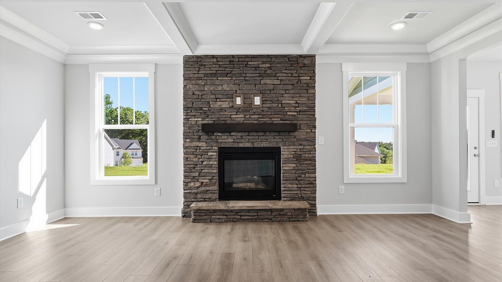Accomplished layout centers around a spacious family room with exceptional flow and flexibility