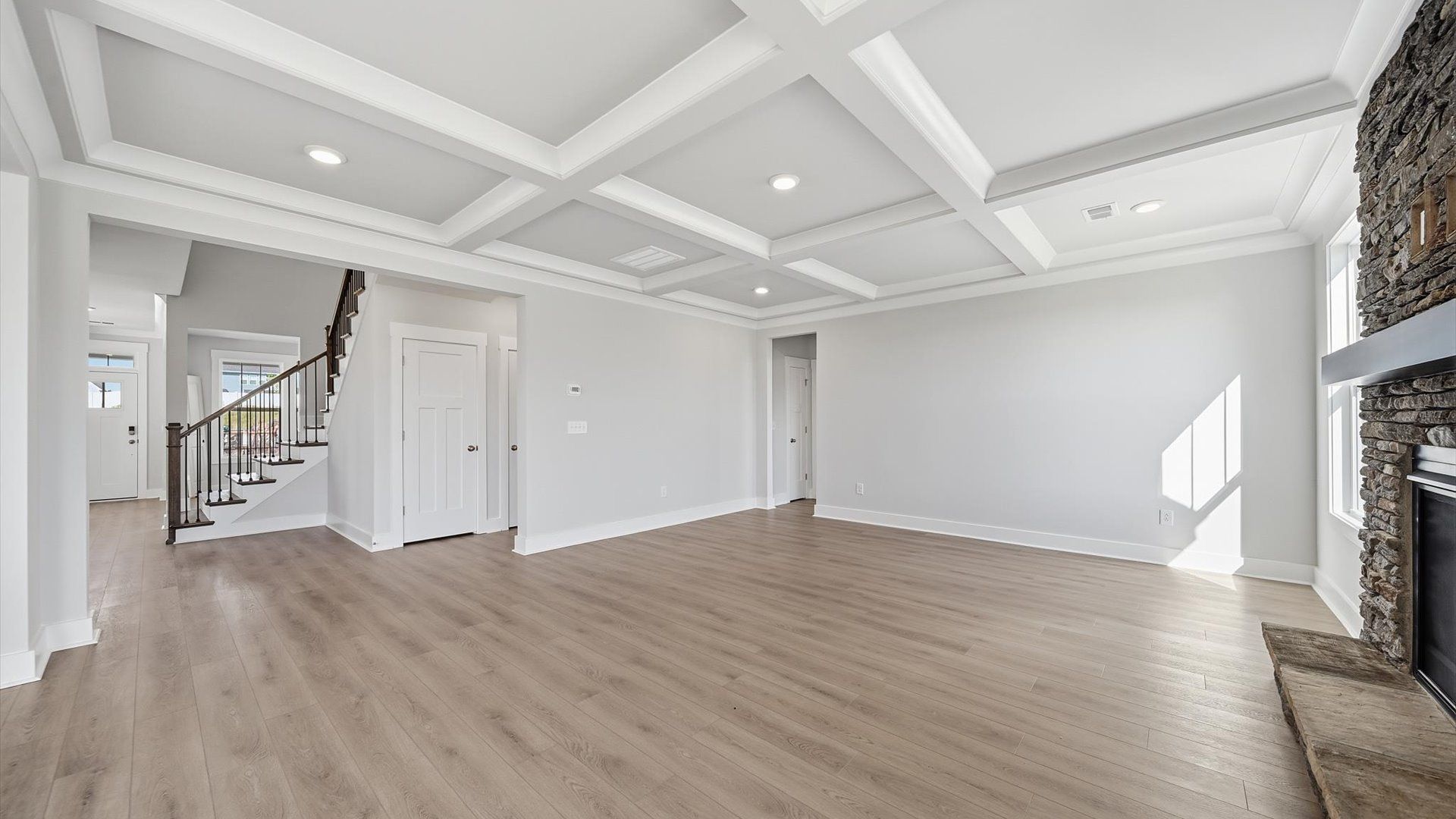Superior design shines in this open-concept family room with timeless finishes and a modern edge at Kayfield at Midway
