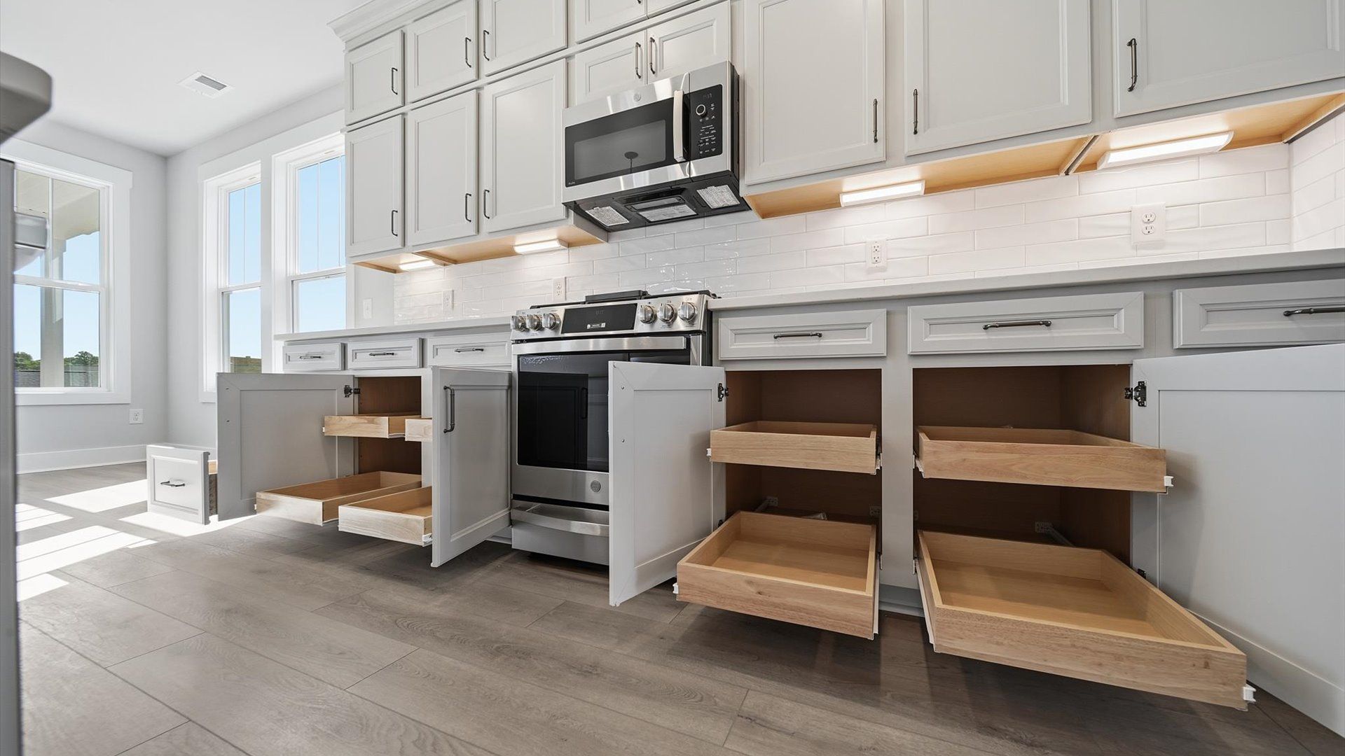 Expansive kitchen offering exceptional storage and effortless flow to adjacent living areas at Kayfield at Midway