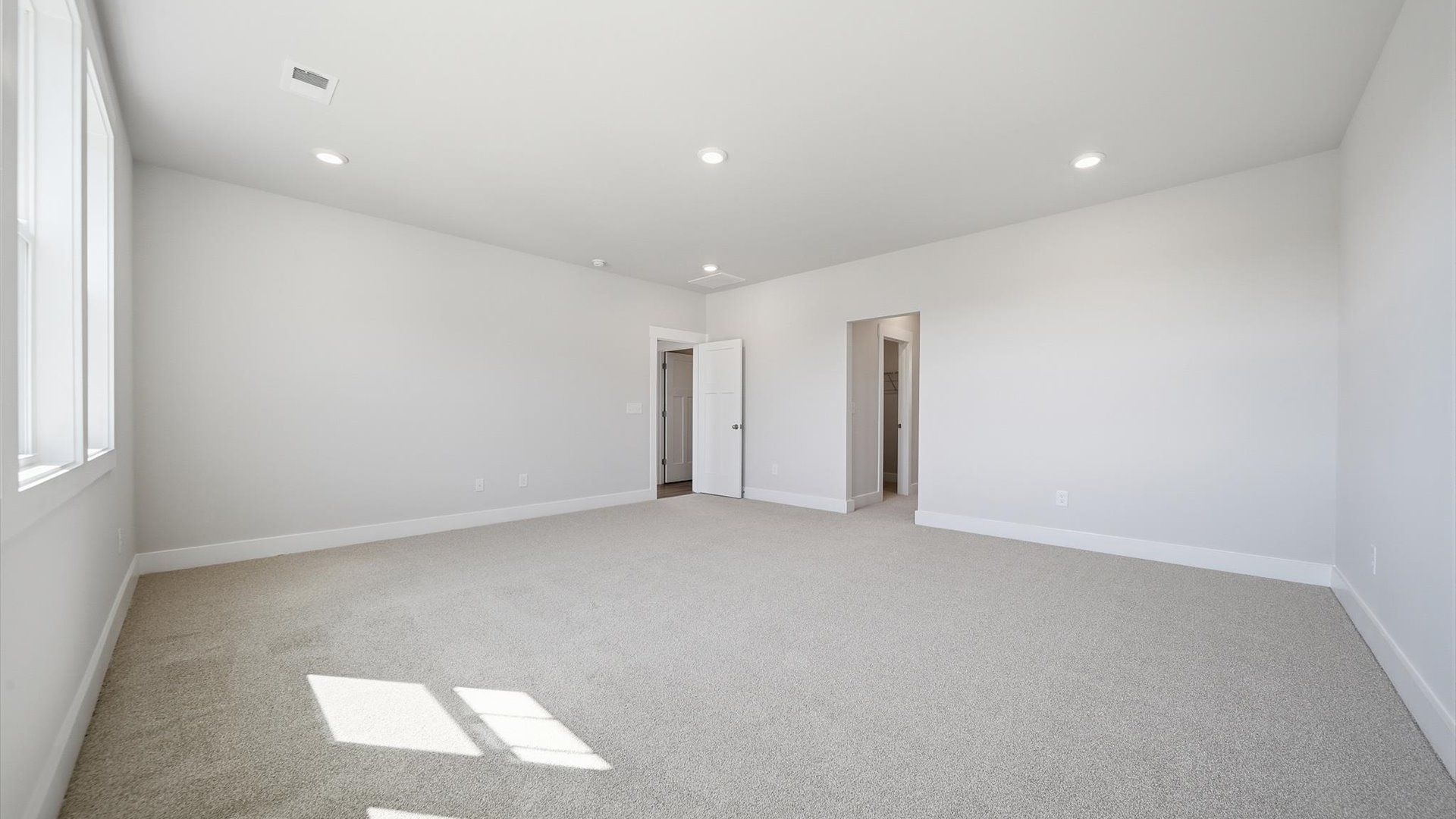 Accomplished primary retreat with eye-catching hardwood flooring in a desirable Anderson community