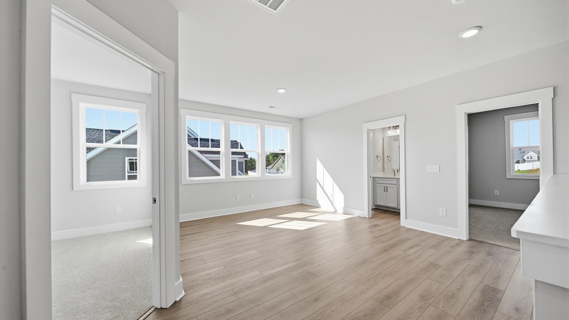 Hardwood flooring enhances the versatility of this elegant upper-level loft space at Kayfield at Midway