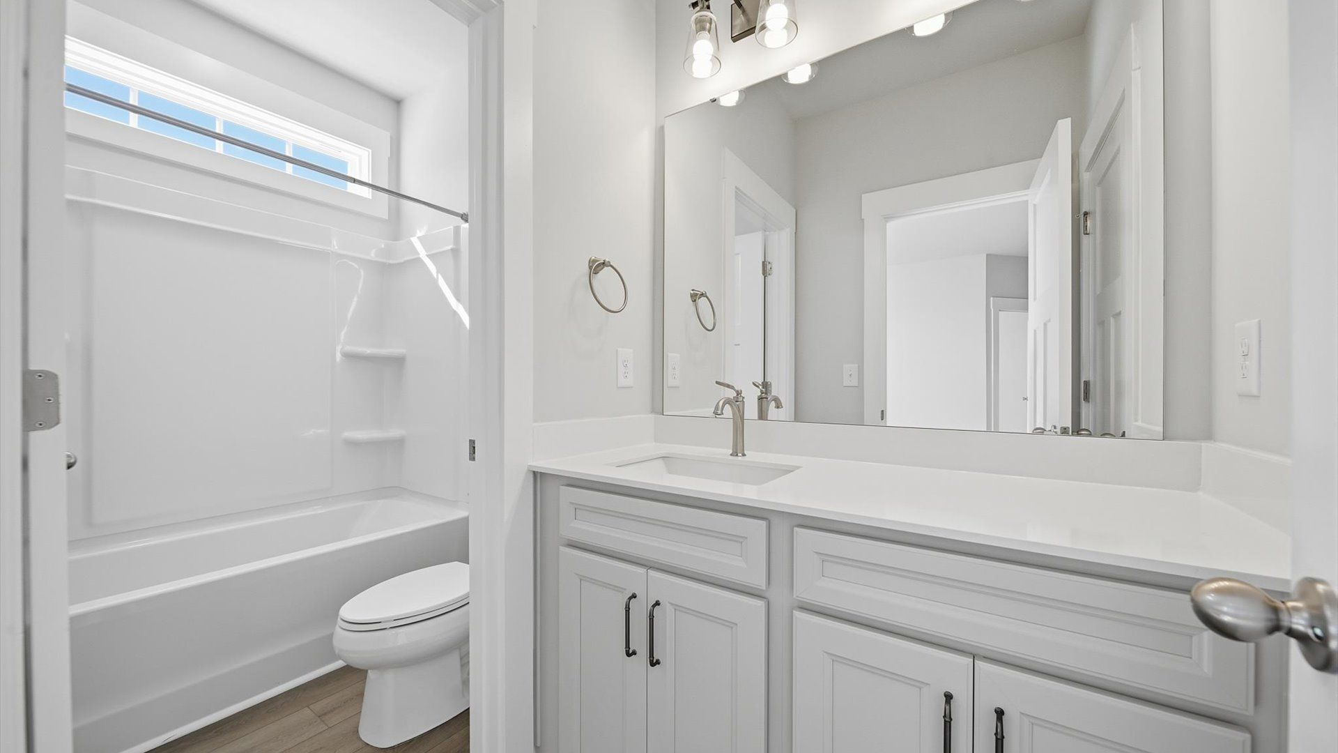 Accomplished full bath designed with both comfort and sophistication in mind