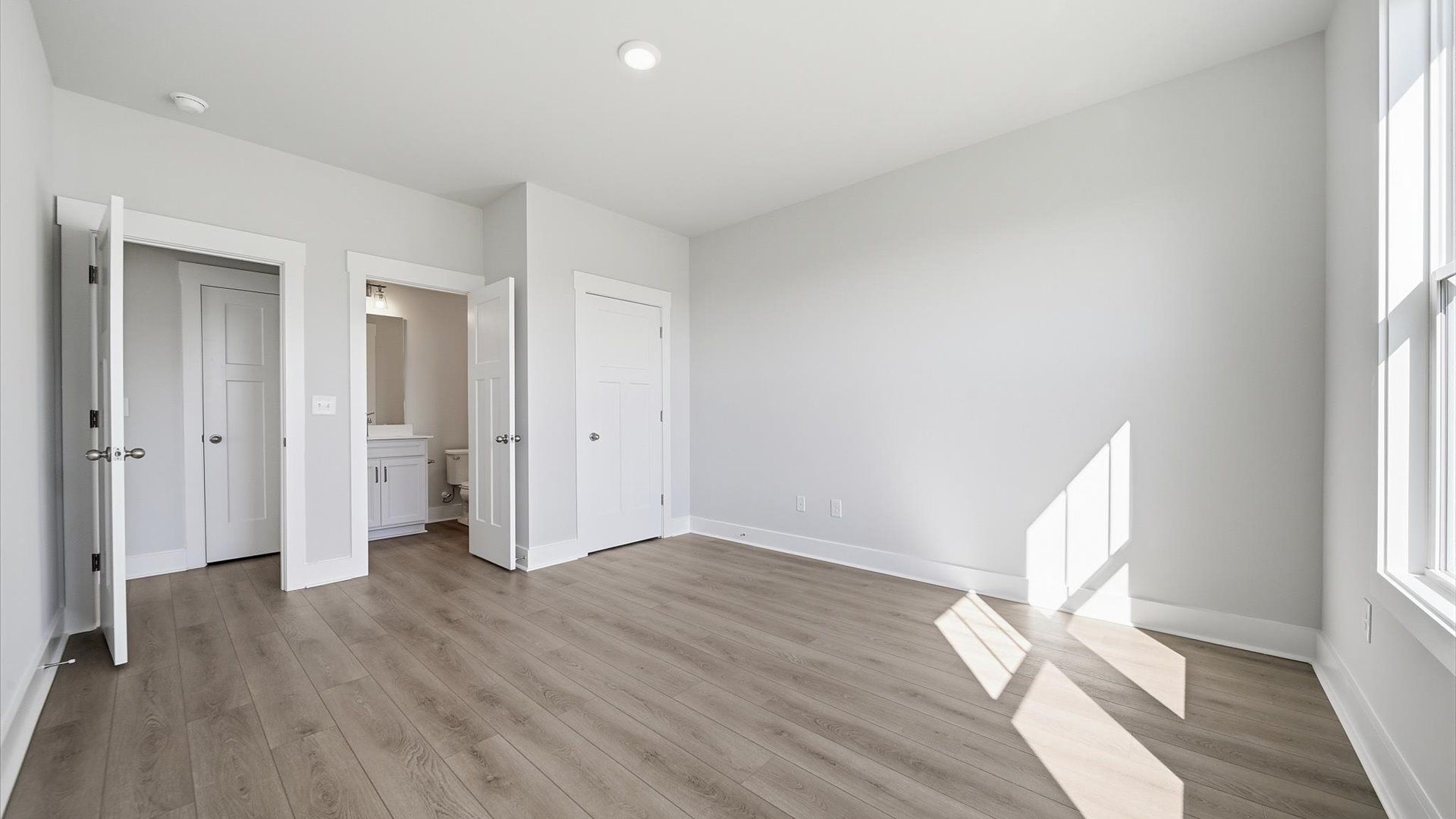 Functional secondary bedrooms with hardwood flooring and modern touches in an exceptional layout in Anderson, SC