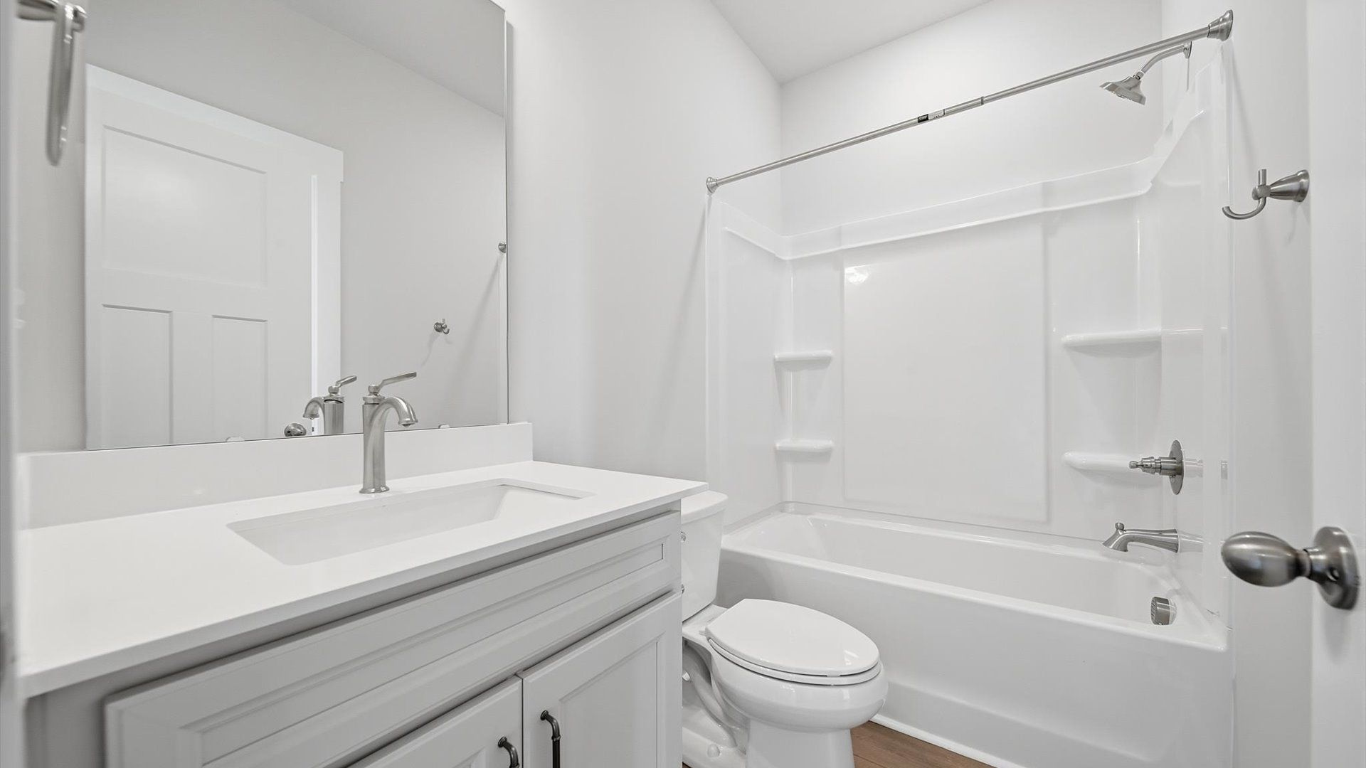 Stylish guest bathroom with superior design and thoughtful storage solutions located near Lake Hartwell