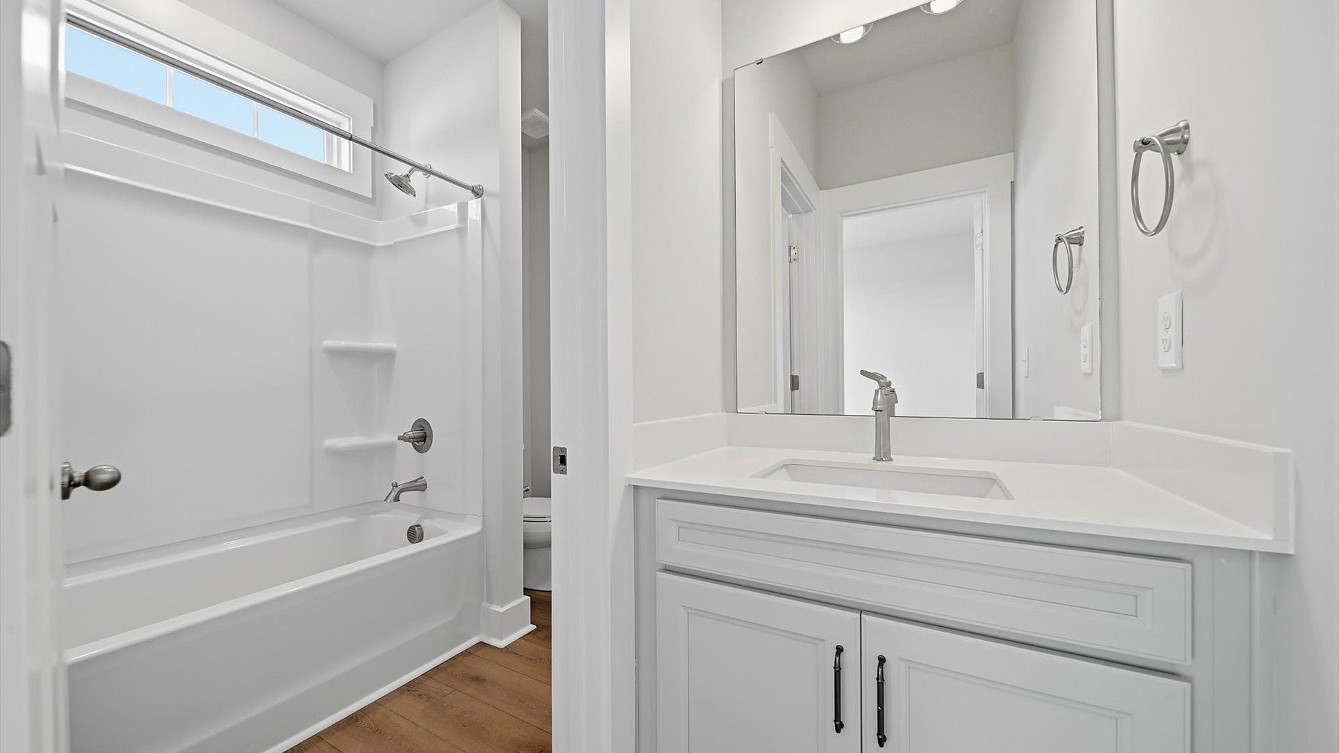 Elegant full bathroom with tasteful finishes and a thoughtfully designed layout at Kayfield at Midway