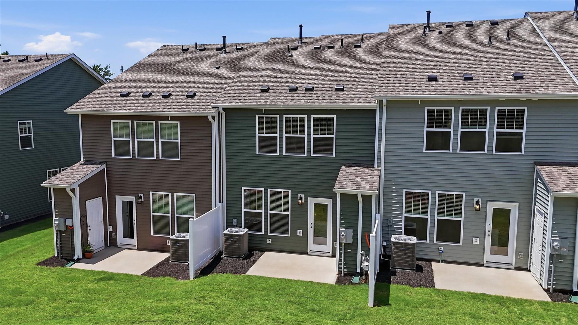 Refined rear exterior with a stylish and private patio for dining, relaxing, or entertaining at Marion Square