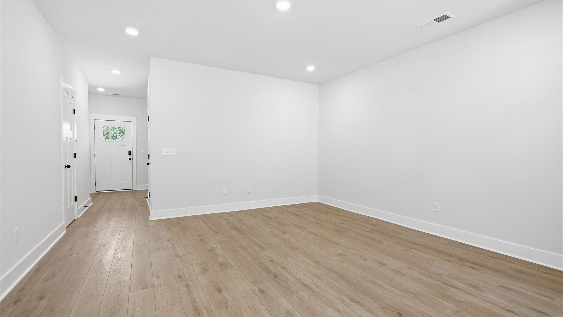 Hardwood flooring and high standards define this vibrant family room ideal for everyday living at the Marion Square community