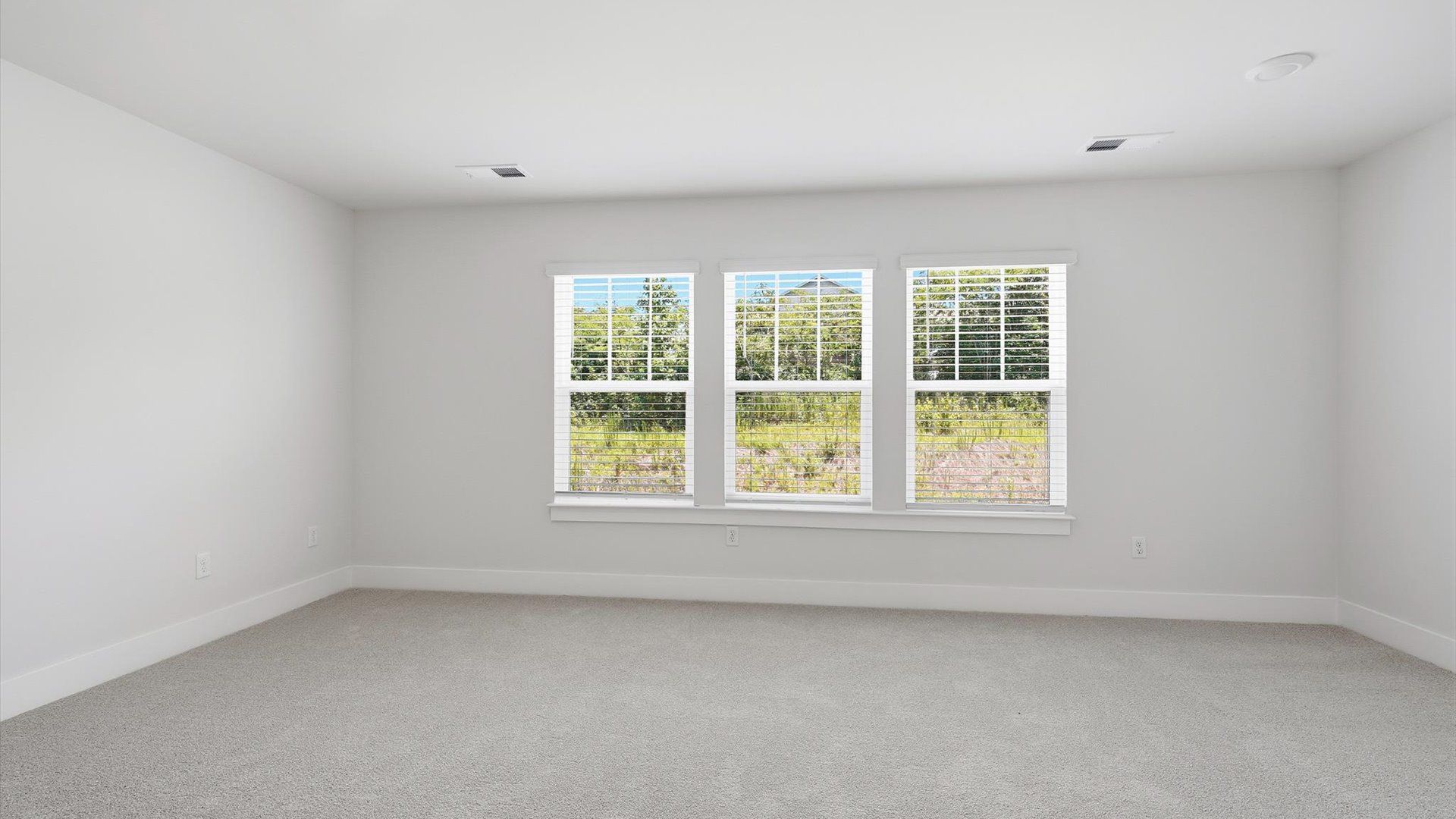 Eye-catching details and elegant finishes in the vibrant primary suite of this select home